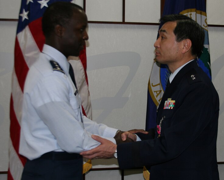Air Force Lt. Gen. Edward A. Rice, Jr., Commander, U.S. Forces Japan, awards Maj. Gen. Hisaya Miyashiro, of the Japan Self Defense Force, the Legion of Merit on April 7 during a ceremony at USFJ Headquarters.