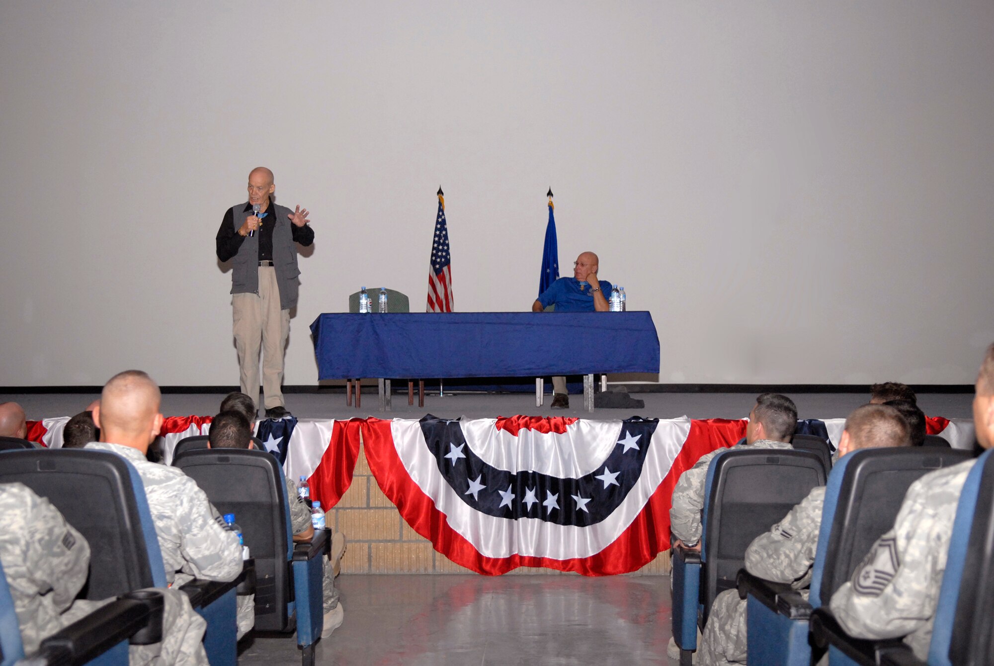 Retired Army Colonel Robert Howard and retired Army Command Sergeant Major Gary Littrell, speak with servicemembers about leadership and the background on their Medals of Honor, Apr. 8, 2009, at an undisclosed location in Southwest Asia.  They were here as part of a USO Medal of Honor tour of the U.S. Central Command's area of responsibility.  Both men are here to inspire and acknowledge servicemembers who are supporting Operations Iraqi and Enduring Freedom and Combined Joint Task Force - Horn of Africa.  (U.S. Air Force photo/Senior Airman Andrew Satran/released)
