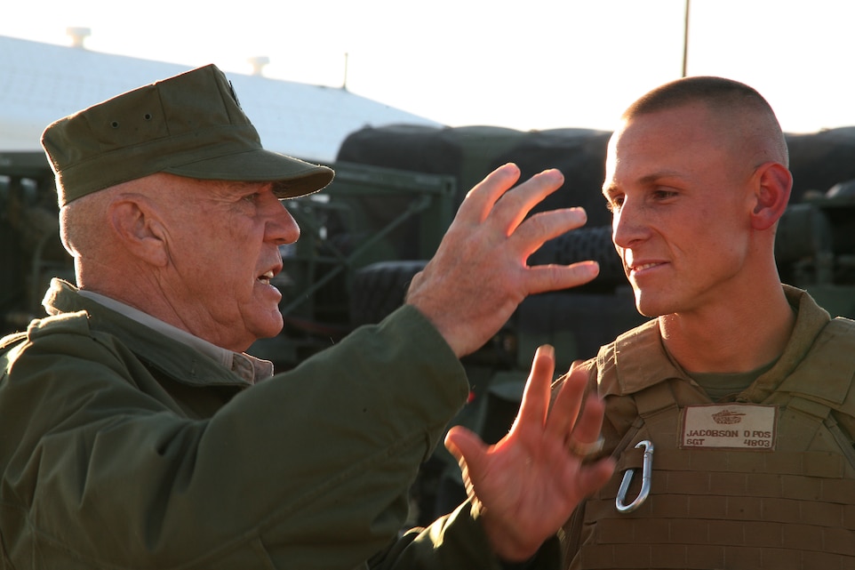 Retired Gunnery Sgt. R. Lee Ermey talks with Sgt. Andrew Jacobson, a tank commander with Company C, 1st Tank Battalion, before they set out to the training areas of the Combat Center April 13 where Ermey filmed part of an episode for his new show, “Lock n’ Load.”