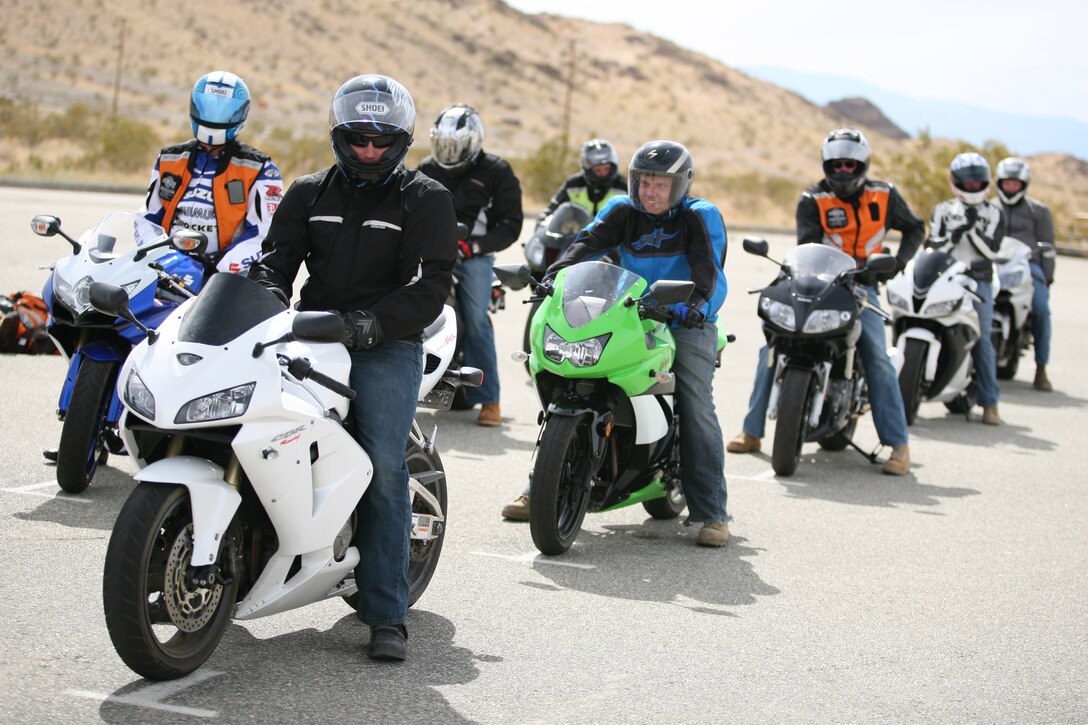 Marines wait in line for a circuit course during a Military Sportbike Rider's Course, offered by Cape Fox Professional Services, for riders looking to improve their skills aboard the Combat Center April. 13.