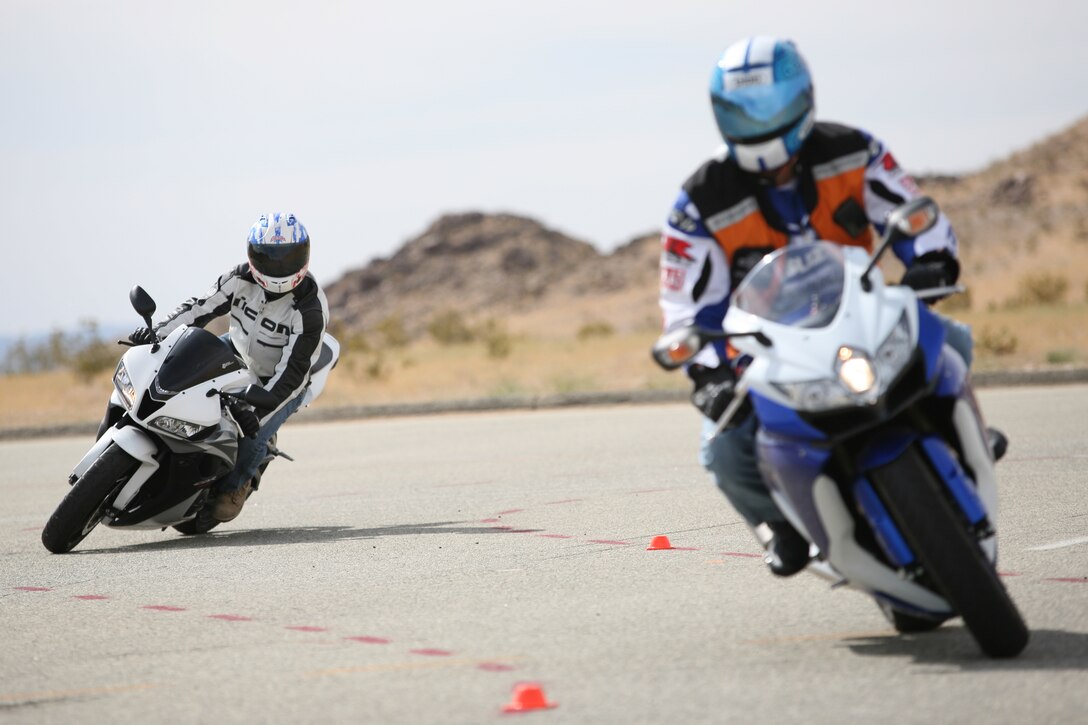 Marines wait in line for a circuit course during a Military Sportbike Rider's Course, offered by Cape Fox Professional Services, for riders looking to improve their skills aboard the Combat Center April. 13.