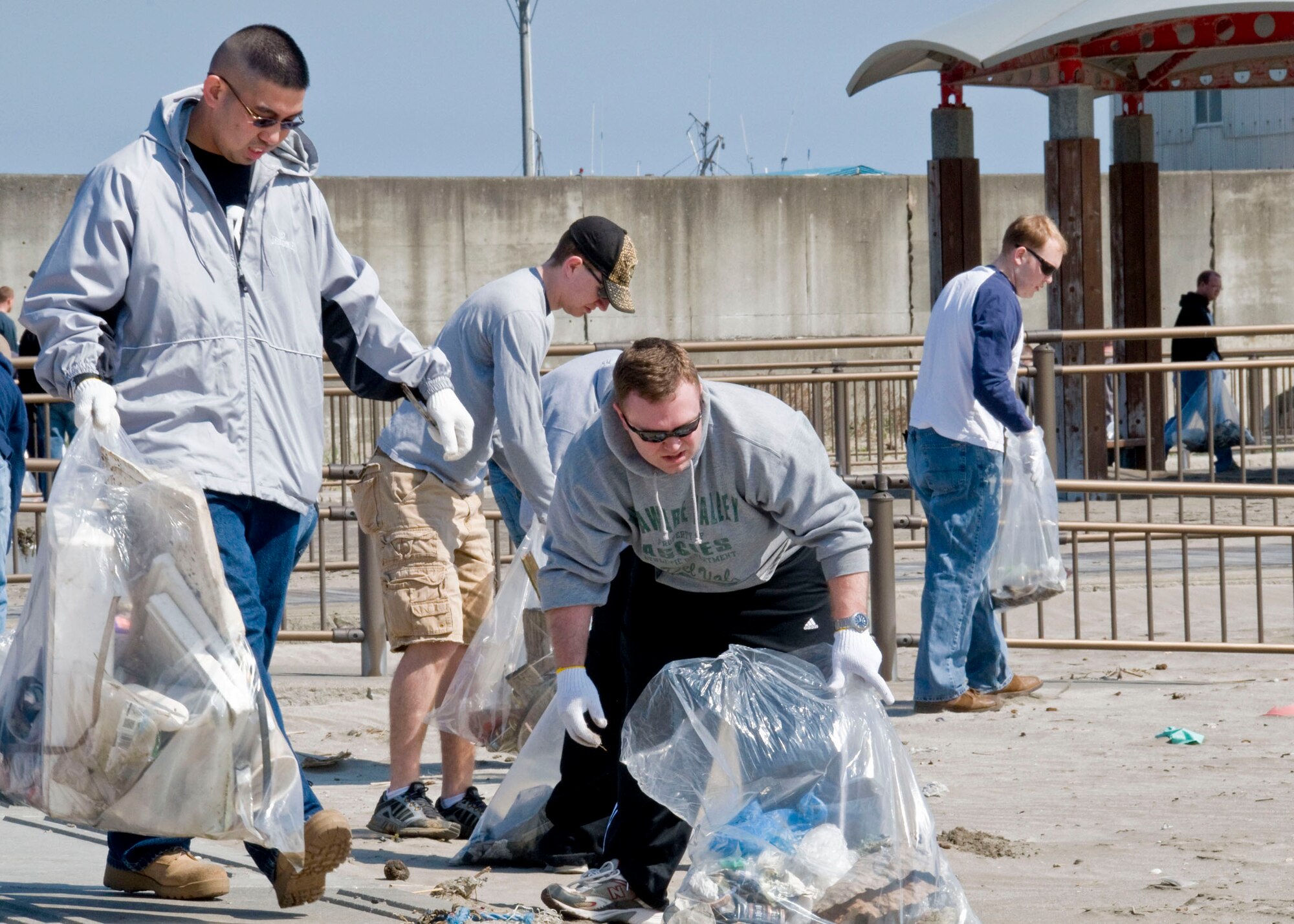 MISAWA, Japan -- Misawa Air Base personnel pick up trash around Misawa port April 11, 2009. The 12th annual Misawa port and beach cleanup in one of many Earth Day events co-sponsored by Misawa Air Base, along with Misawa city and Misawa Fishery Association. (U.S Air Force by Staff Sgt. Araceli Alarcon)