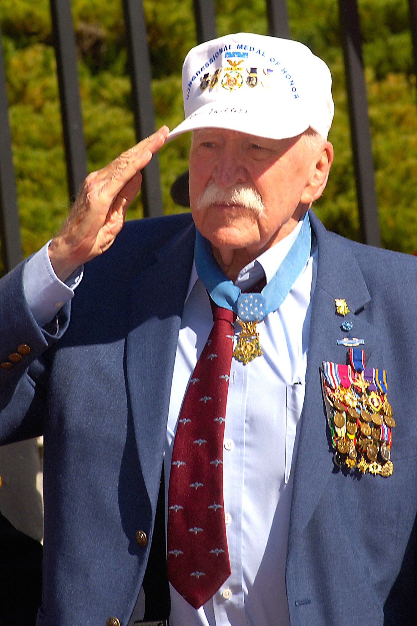 Retired Army Col. Lewis Millett offers a salute during a special ceremony Sept. 27 at the State House in Boston. The ceremony honored more than 70 Medal of Honor recipients in Boston for their annual convention. Colonel Millett, who was a captain at the time, received the Medal of Honor in 1951 for leading an uphill bayonet charge against enemy forces during the Korean War. (U.S. Air Force photo Jan Abate)