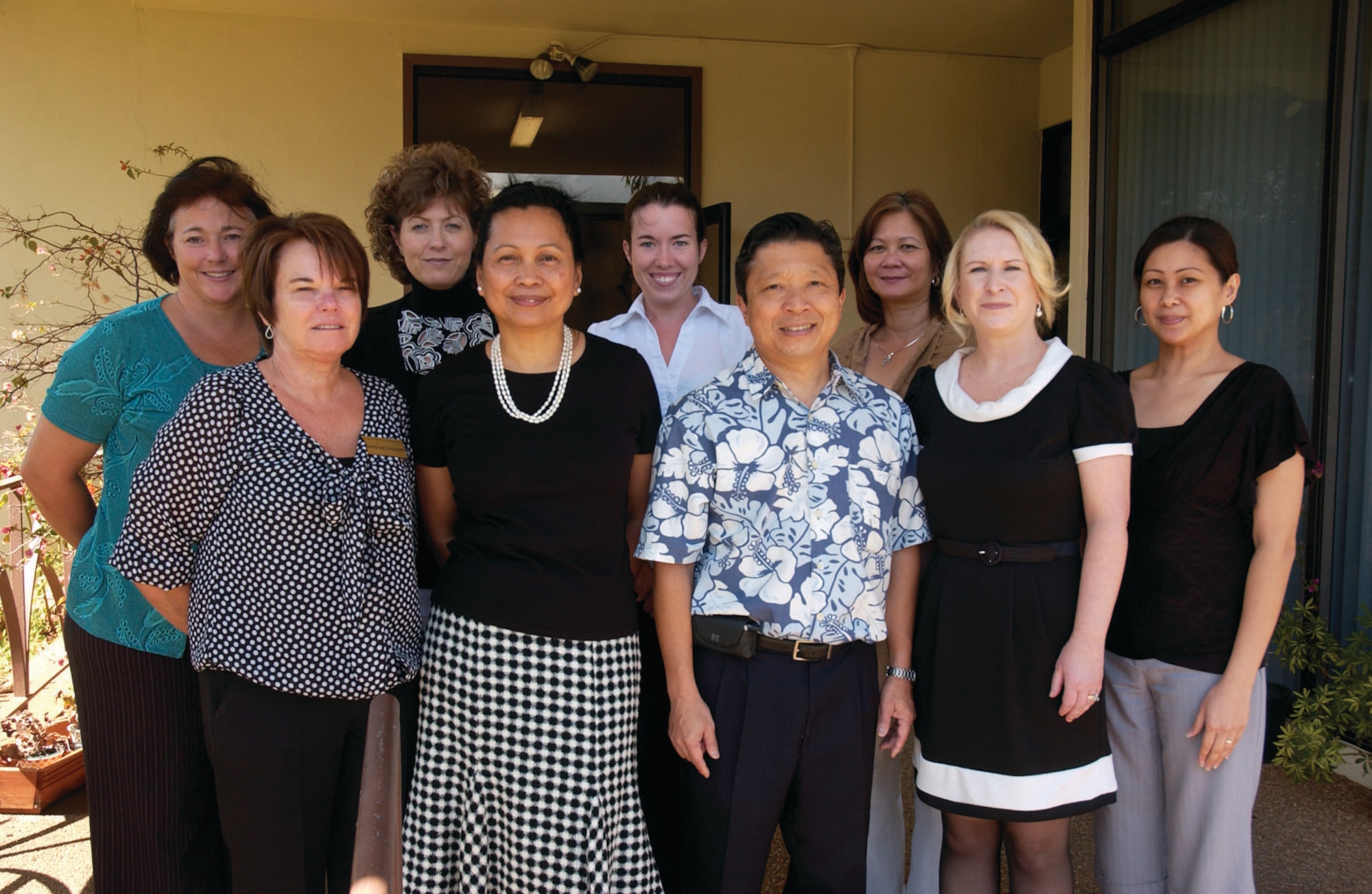 HICKAM AIR FORCE BASE, Hawaii -- Airmen and Family Readiness Center staff: front, Jackie DeChaine, Maria Barrows, Gary Hasegawa, Ruth Moore and Shelita Soriano; back, Chanda Johnston, Laurie Livingston, Amy Cowan and Merlyn Bacungan. (Photos by Chris Aguinaldo)
