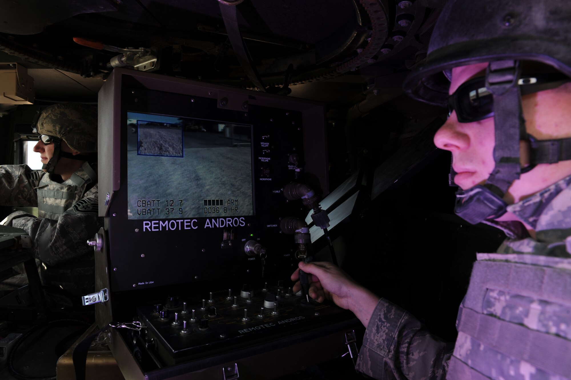 Airman 1st Class Lyle Flagg, an explosive ordnance disposal (EOD) journeyman with the 99th Civil Engineer Squadron, uses the F6A robot and it's mounted camera to remove an improvised explosive device (IED) from the safety of a high mobility multi-purpose wheeled vehicle (HUMVEE), April 9, Nellis Air Force Base, Nev. EOD uses its' first line defender to neutralize potential threats to Air Force assets and personnel state side and abroad.
(U.S. Air Force photo by Senior Airman Nadine Y. Barclay/RELEASED)