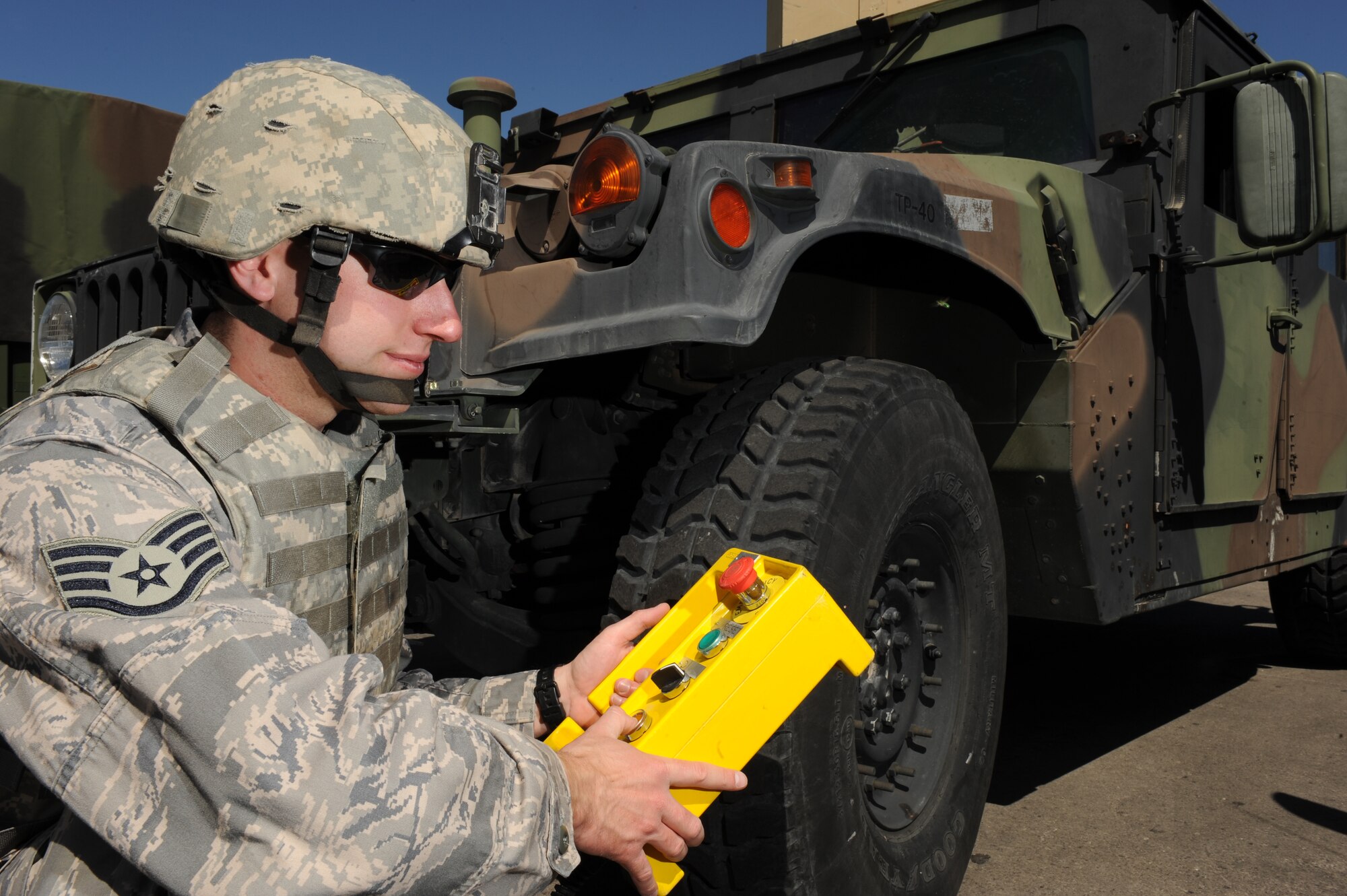 Staff Sgt. Brian Dube, an explosive ordnance disposal (EOD) journeyman with the 99th Civil Engineer Squadron, manually operates the controls for a total containment vessel (TCV) during a simulated deployed scenario, April 9, Nellis Air Force Base, Nev. EOD personnel use the TCV to contain blasts from various explosive devices. 
(U.S. Air Force photo by/Senior Airman Nadine Y. Barclay/RELEASED)
