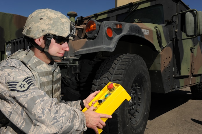 Staff Sgt. Brian Dube, an explosive ordnance disposal (EOD) journeyman with the 99th Civil Engineer Squadron, manually operates the controls for a total containment vessel (TCV) during a simulated deployed scenario, April 9, Nellis Air Force Base, Nev. EOD personnel use the TCV to contain blasts from various explosive devices. 
(U.S. Air Force photo by/Senior Airman Nadine Y. Barclay/RELEASED)