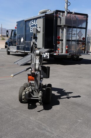 Explosive ordnance disposal (EOD) personnel use the F6A robot and a total containment vessel (TCV) to manually remove and neutralize potential threats to Air Force assets. The TCV is designed to handle and dispose of explosive ordnances.
(U.S. Air Force photo by Senior Airman Nadine Y. Barclay/RELEASED)