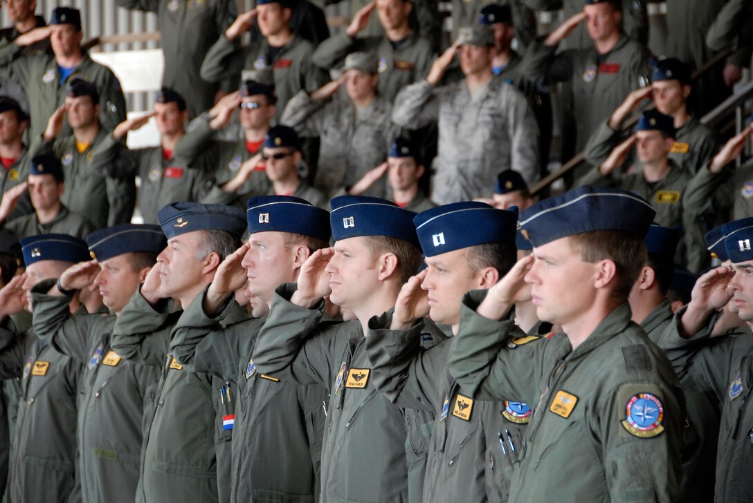 Members of the 90th Flying Training Squadron render one last salute to The Netherlands air force Lt. Col. Harry Osteema, outgoing commander of the 90th FTS, during a change of command ceremony April 10. German air force Lt Col. Oliver Habel assumed command of the squadron. (U.S. Air Force photo/Mike Litteken)