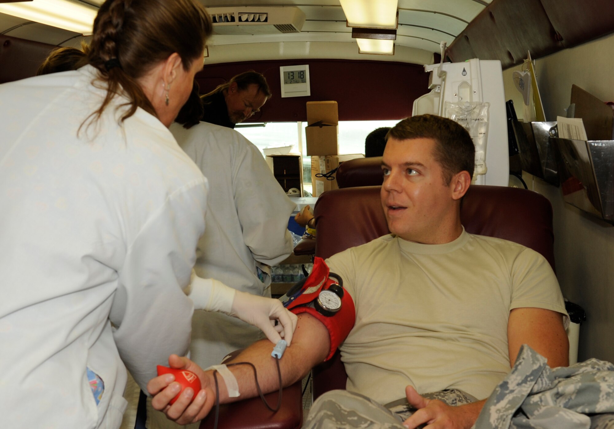 VANDENBERG AIR FORCE BASE, Calif.-- A physician with the United Blood Services applies pressure to the arm of 2nd Lt. Erik Ringstad, a 392nd Training Group student, after puncturing the median cubital vein April 2. Vandenberg hosts frequent blood drives. The last blood drive, held by the 30th Security Forces Squadron, saw 67 potential donors and donated 45 units of blood to the local community. (U.S. Air Force Photo/Senior Airman Stephanie Longoria)


