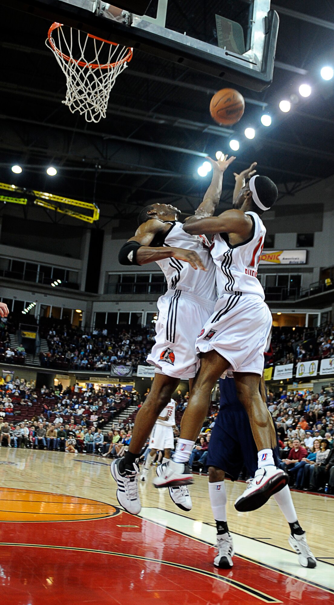MOUNTAIN HOME AIR FORCE BASE, Idaho -- Jason Ellis and Kevin Burleson, Boise Stampede, fight for the ball in the middle of the second quarter, April 10. More than 4,000 people made up of Mountain Home AFB personnel and local fans of the Idaho Stampede gathered together for the Air Power Night basketball game April 10 at the Qwest Arena in Boise, Idaho. (U.S. Air Force photo/ Senior Airman Stephany Miller)