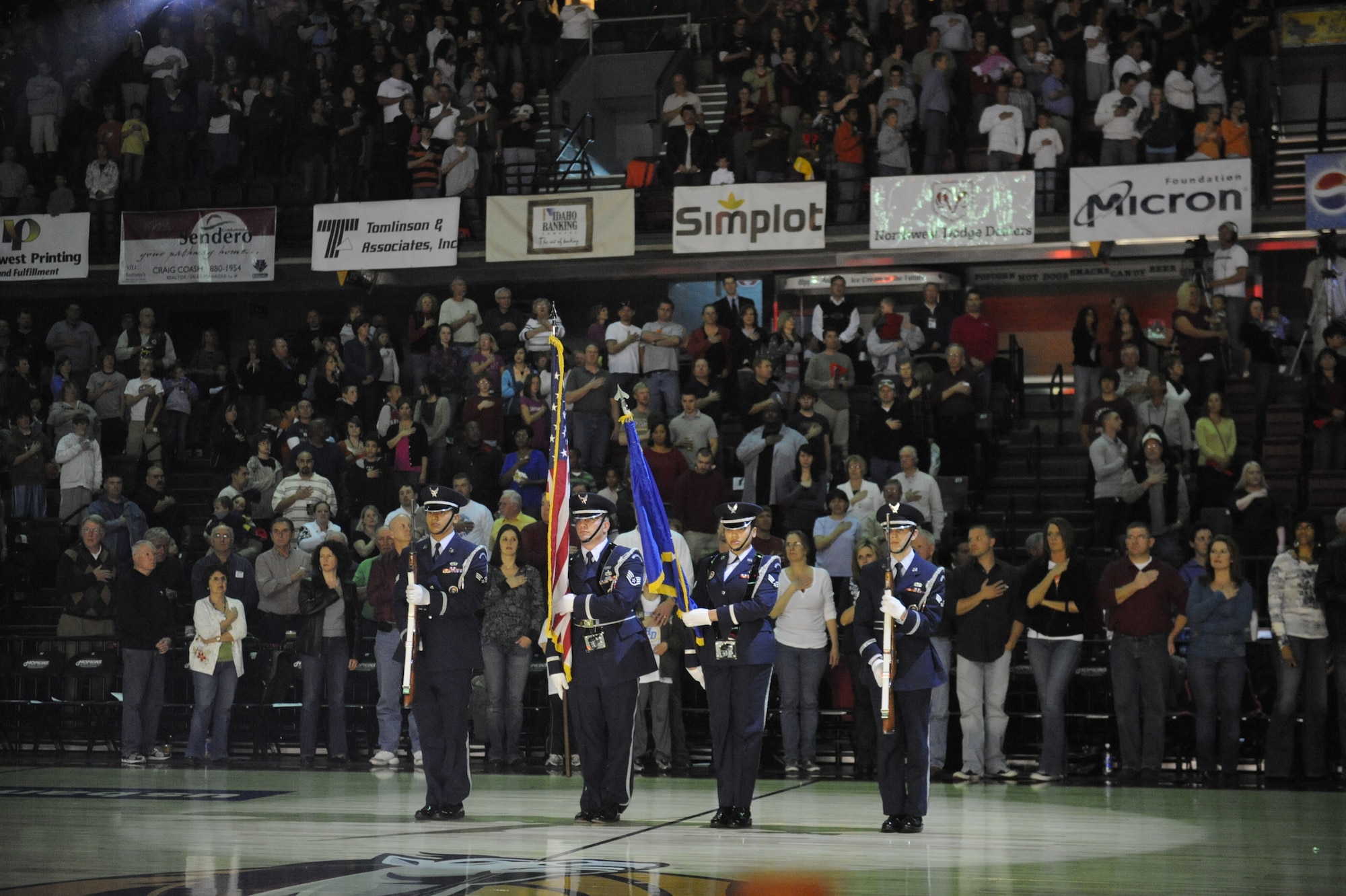 MOUNTAIN HOME AIR FORCE BASE, Idaho -- Prior to tip-off, the singing stripes sang their rendition of the national anthem, the base honor guard team presented the colors. More than 4,000 people made up of Mountain Home AFB personnel and local fans of the Idaho Stampede gathered together for the Air Power Night basketball game April 10 at the Qwest Arena in Boise, Idaho. (U.S. Air Force photo/ Senior Airman Stephany Miller)