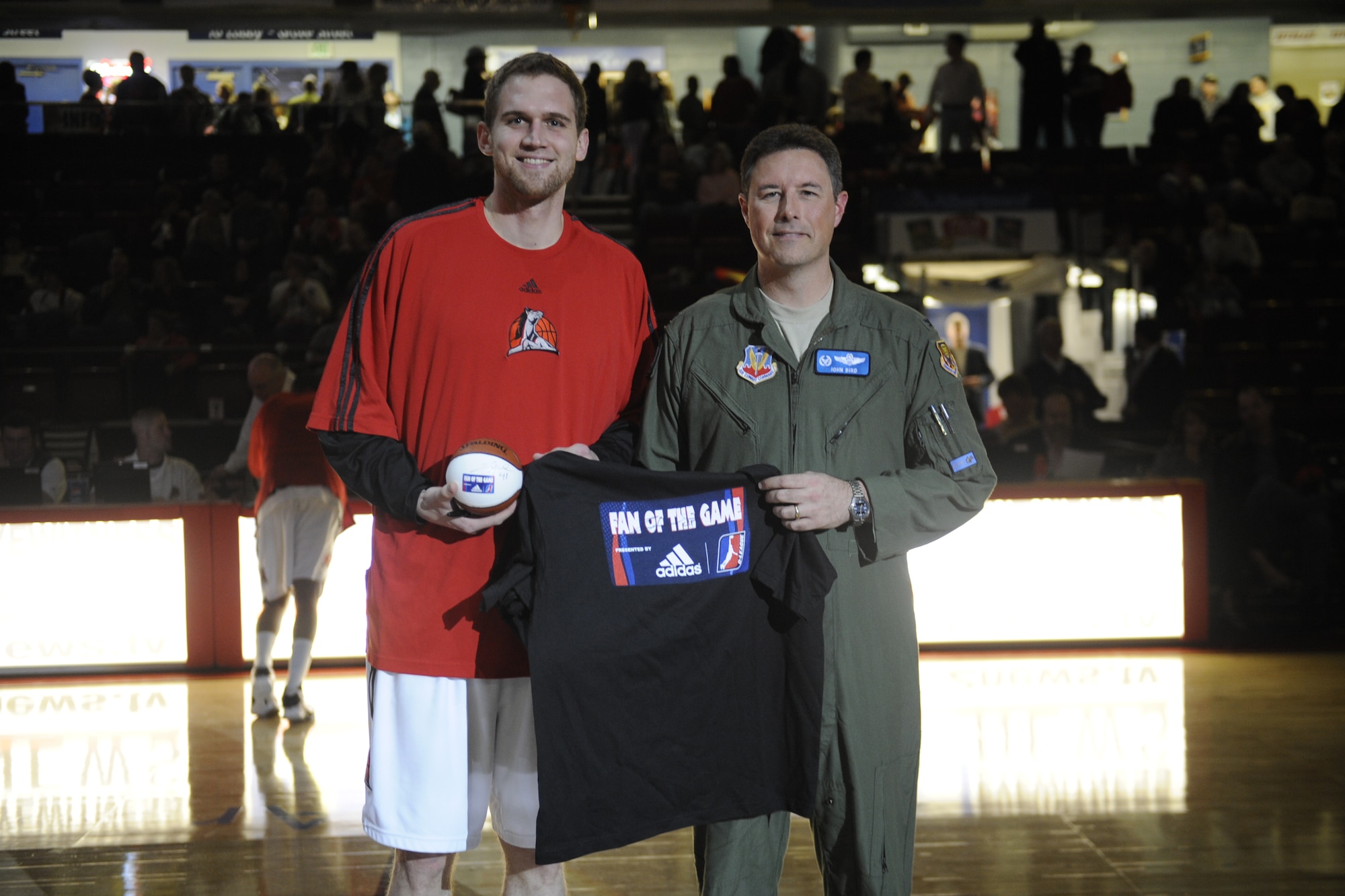 MOUNTAIN HOME AIR FORCE BASE, Idaho -- Prior to tip-off, the Idaho Stampede presented Col. John Bird II, 366th Fighter Wing commander, with a team shirt and basketball. More than 4,000 people made up of Mountain Home AFB personnel and local fans of the Idaho Stampede gathered together for the Air Power Night basketball game April 10 at the Qwest Arena in Boise, Idaho. (U.S. Air Force photo/ Senior Airman Stephany Miller)