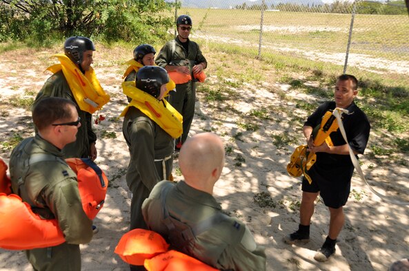 Survival, evasion, resistance, escape, or SERE instructor Tech. SGt. Sherwood Brown prepares members of the Hickam Air Force Base, Hawaii, flying community for refresher water survival training April 6. (U.S. Air Force photo/Tech Sgt. Cohen A. Young) 