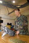 Master Sgt. Teresa Lapcheske examines a monitor device in her Nondestructive Inspection laboratory that has been named the best in the Air Force. The NDI lab is part of the 908th Maintenance Group that maintains the eight C-130 aircraft of the 908th Airlift Wing. (Air Force photo by Jeff Melvin)
