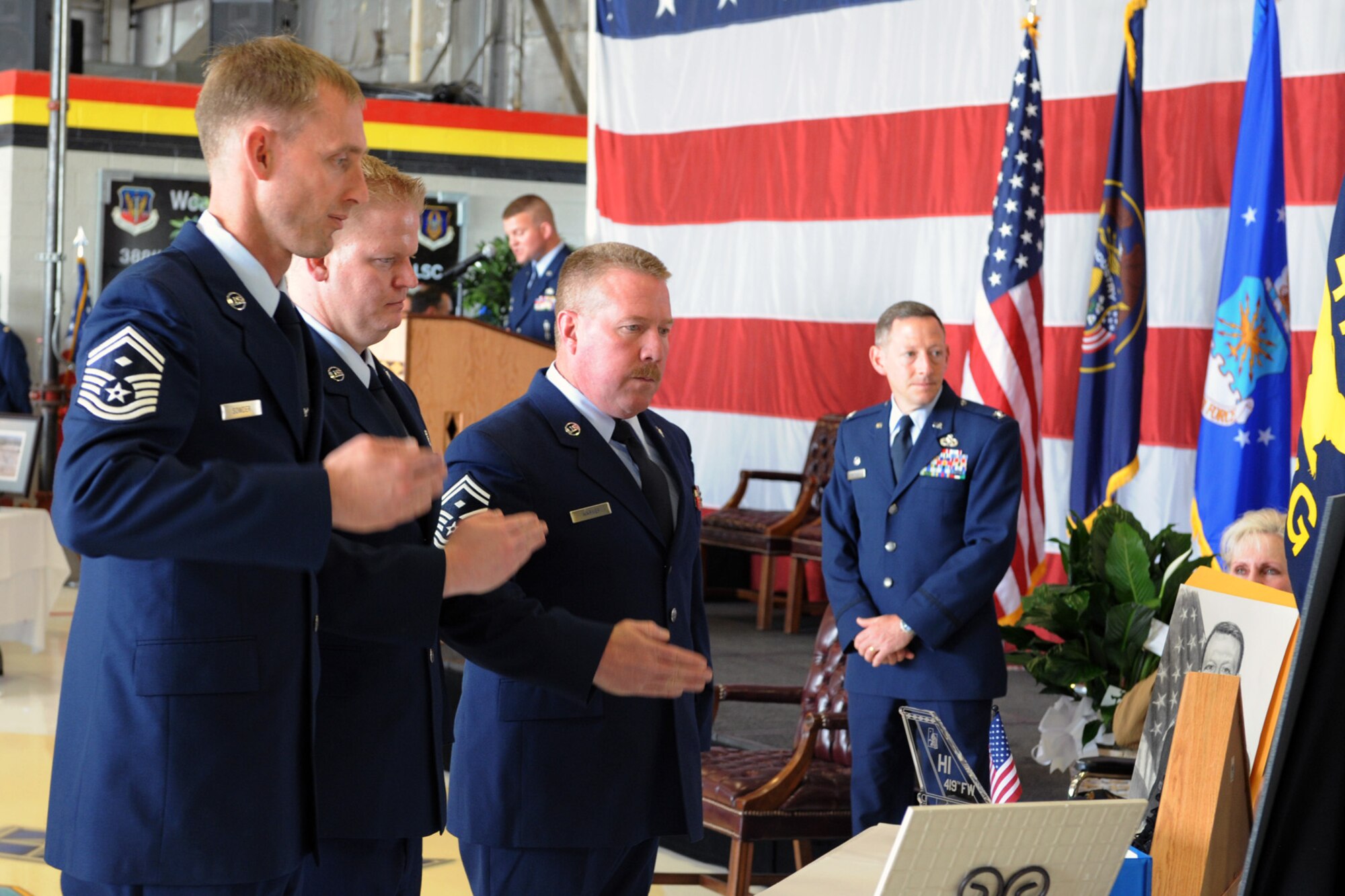 Senior Master Sgt. John Sowder, Senior Master Sgt. Ralph Thompson, and Senior Master Sgt. David Warner, first sergeants for the 419th Fighter Wing’s Aircraft Maintenance Squadron, Maintenance Squadron, and Maintenance Operations Flight respectively, salute in memory of Col. Stephen E. Mittuch, commander of the 419th Maintenance Group. The wing held a memorial service in the colonel’s honor Apr. 10. (U.S. Air Force photo/Staff Sgt. Kyle Brasier)