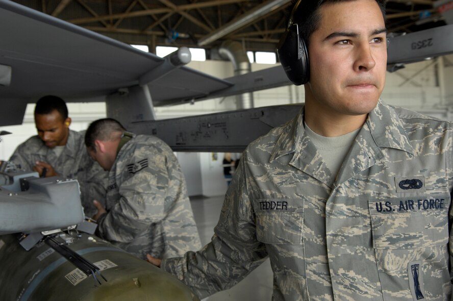 Senior Airman Stetson Tedder, a member of the 55th Air Maintenance Unit, looks for his next move during the Weapons Load Crew of the Quarter Competition at Shaw AFB, S.C., April 10, 2009. Load crews are evaluated on safety and reliability as well as a toolbox inspection and written exam.  (U.S. Air Force photo by Senior Airman Kathrine McDowell/Released)