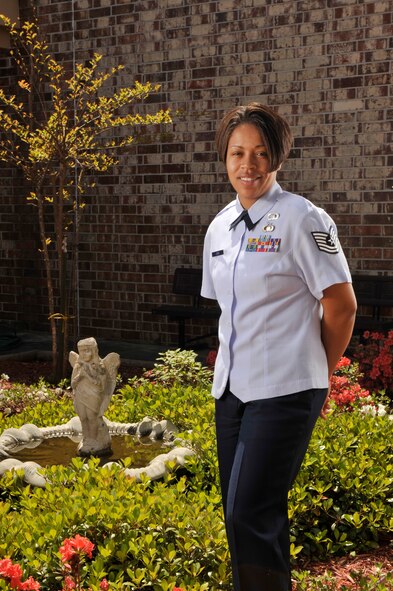 MOODY AIR FORCE BASE, Ga. -- Tech. Sgt. Courtney Jones, NCO in charge of chapel operations, stands next to a water foundation inside the Base Chapel’s interior courtyard. Sergeant Jones recently won the Air Force Outstanding Chaplain Assistant NCO of the Year Award for 2008.  (U.S. Air Force photo by Senior Airman Schelli Jones)