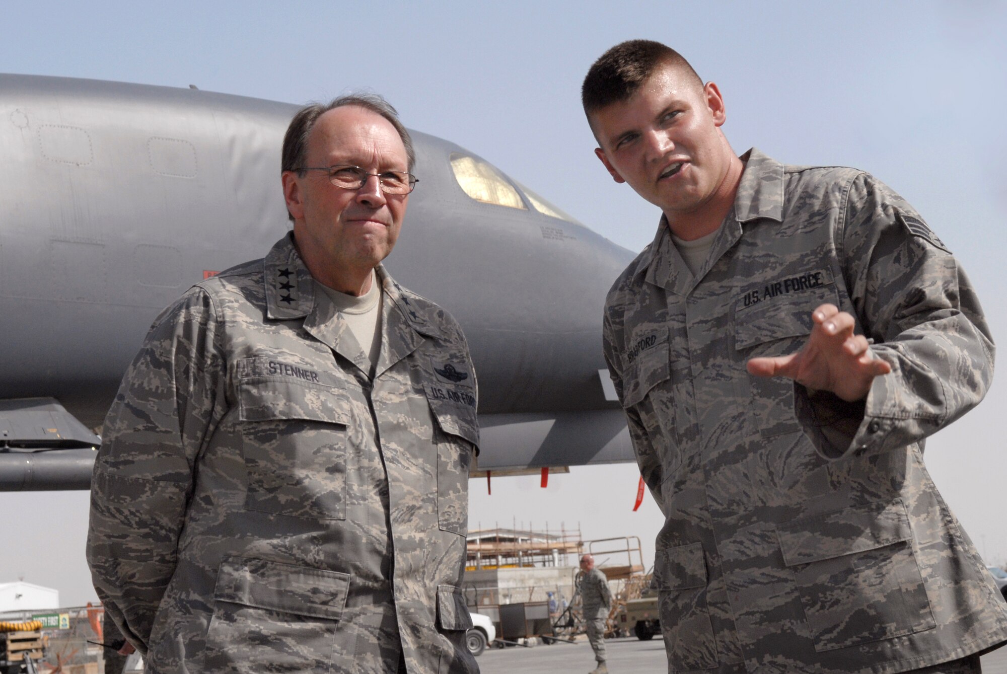 Lt. Gen. Charles Stenner, commander of Air Force Reserve Command and chief of the Air Force Reserve, discusses B-1B Lancer weapons loads April 6 with Senior Airman Timothy Bradford during a tour of an air base in Southwest Asia.  General Stenner visited many areas of the base and spoke with numerous Airmen.  Airman Bradford, a maintainer with the 379th Expeditionary Maintenance Squadron, is deployed from Dyess Air Force Base, Texas. (U.S. Air Force photo/Senior Airman Andrew Satran)
