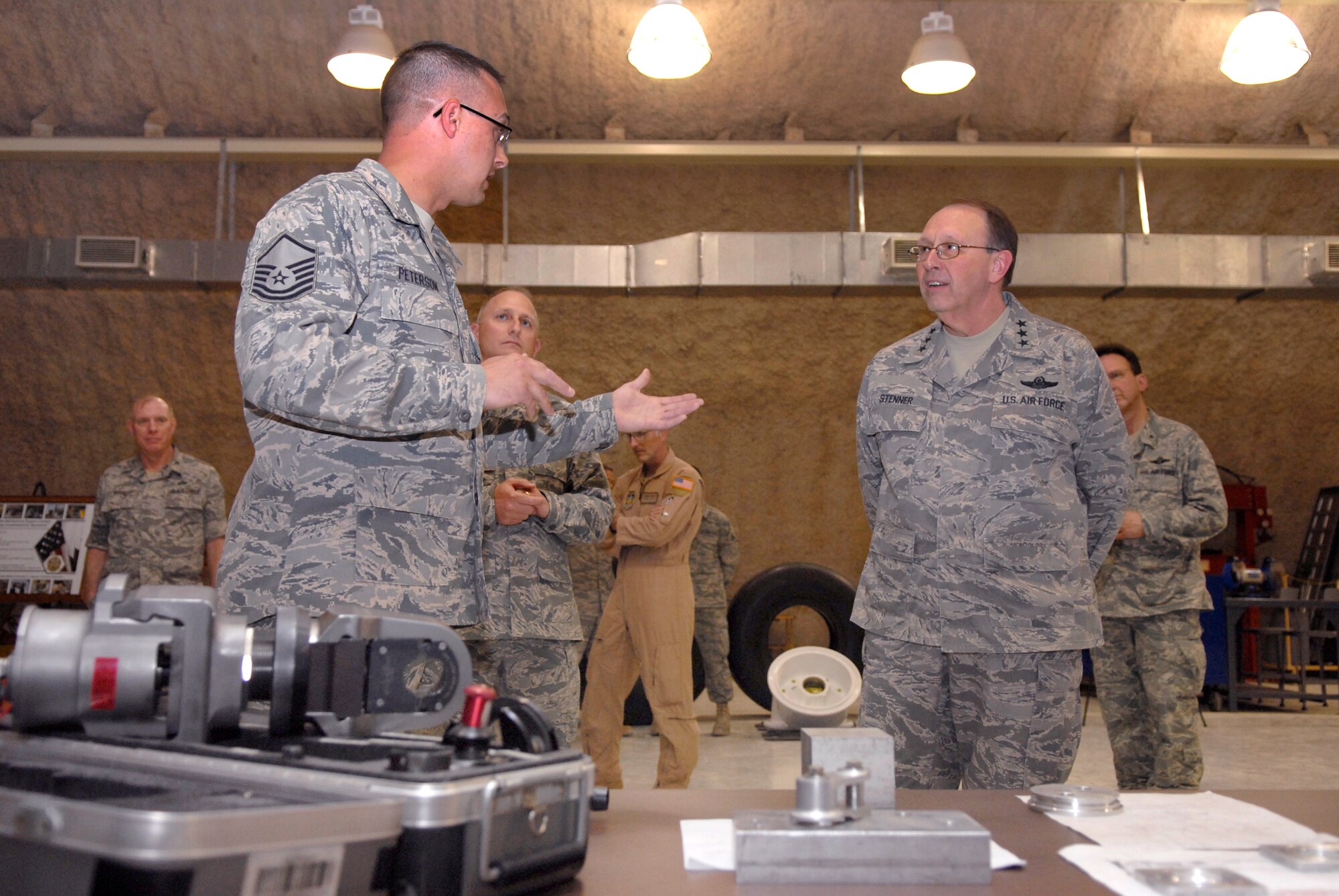 Master Sgt. Jason Peterson briefs Lt. Gen. Charles Stenner, commander of Air Force Reserve Command and chief of the Air Force Reserve, April 6 during a visit of the 379th Expeditionary Maintenance Squadron Centralized Repair Facilities at an air base in Southwest Asia.  General Stenner visited many areas of the base and spoke with numerous Reserve Airmen.  Sergeant Peterson, a metals tech craftsman with the 379th EXMS, is deployed from Grissom Air Reserve Base, Ind.. (U.S. Air Force photo/Senior Airman Andrew Satran)