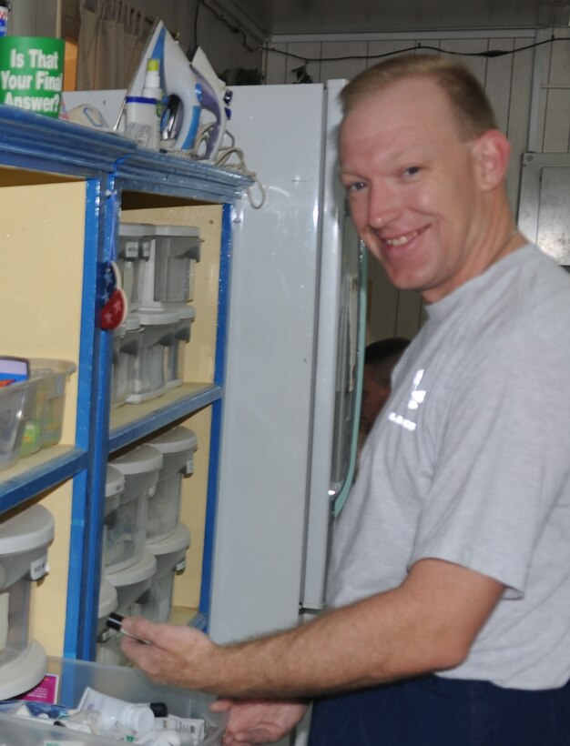 Joint Base Balad-- Tech. Sgt. Craig James, deployed from the 932nd Operations Support Squadron, volunteers three times a week at Troy’s Place. Troy’s Place is a chapel annex named for Maj. Troy Gilbert who was killed in OIF. The annex has hygiene products, snacks, books, and computers for e-mail, Sergeant James meets and greets everyone that comes in for coffee or whatever. 
"Sometime they come in just to talk or vent. Makes me feel good to be there for them," he said. Sergeant James is currently assigned to the 332nd Expeditionary Operations Support Squadron at Balad. Photo/Maj. Stan Paregien

 
