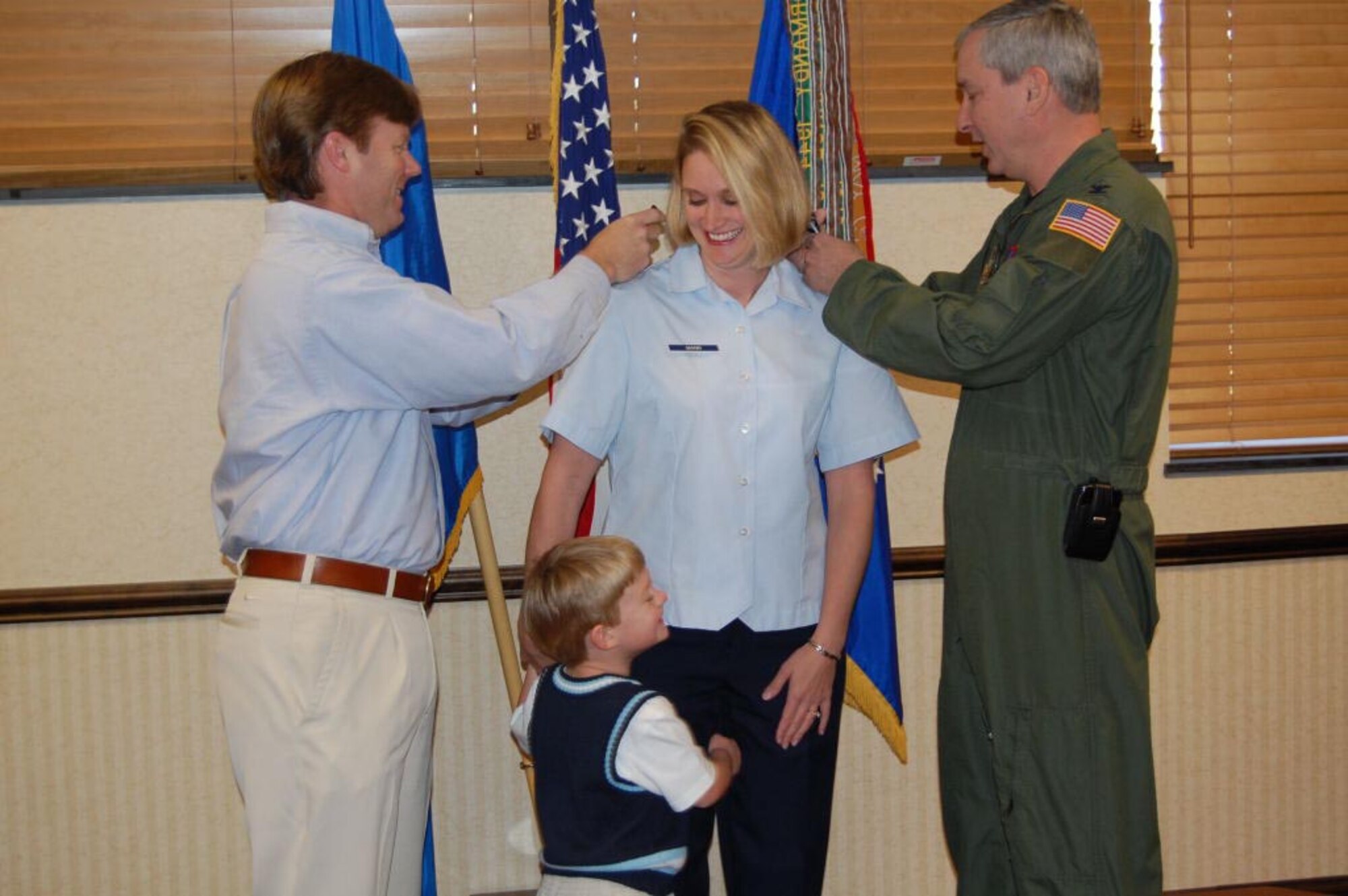 SEYMOUR JOHNSON AIR FORCE BASE, N.C. -- Col. Fritz Linsenmeyer (right), wing commander of the 916th Air Refueling Wing pins the rank of major on Reservist Shannon Mann on April 9. Also announced to the rank of major from the 916th are Maj. Kim Lewis from the Operations Group, Maj. Ron Brand, Maj. Tom Davis and Maj. Dave Moss from the 77th Air Refueling Squadron and Maj. Fabian Rodriguez from the Aerospace Medicine Flight. (U.S. Air Force photo by Maj. Wendy Gresis)