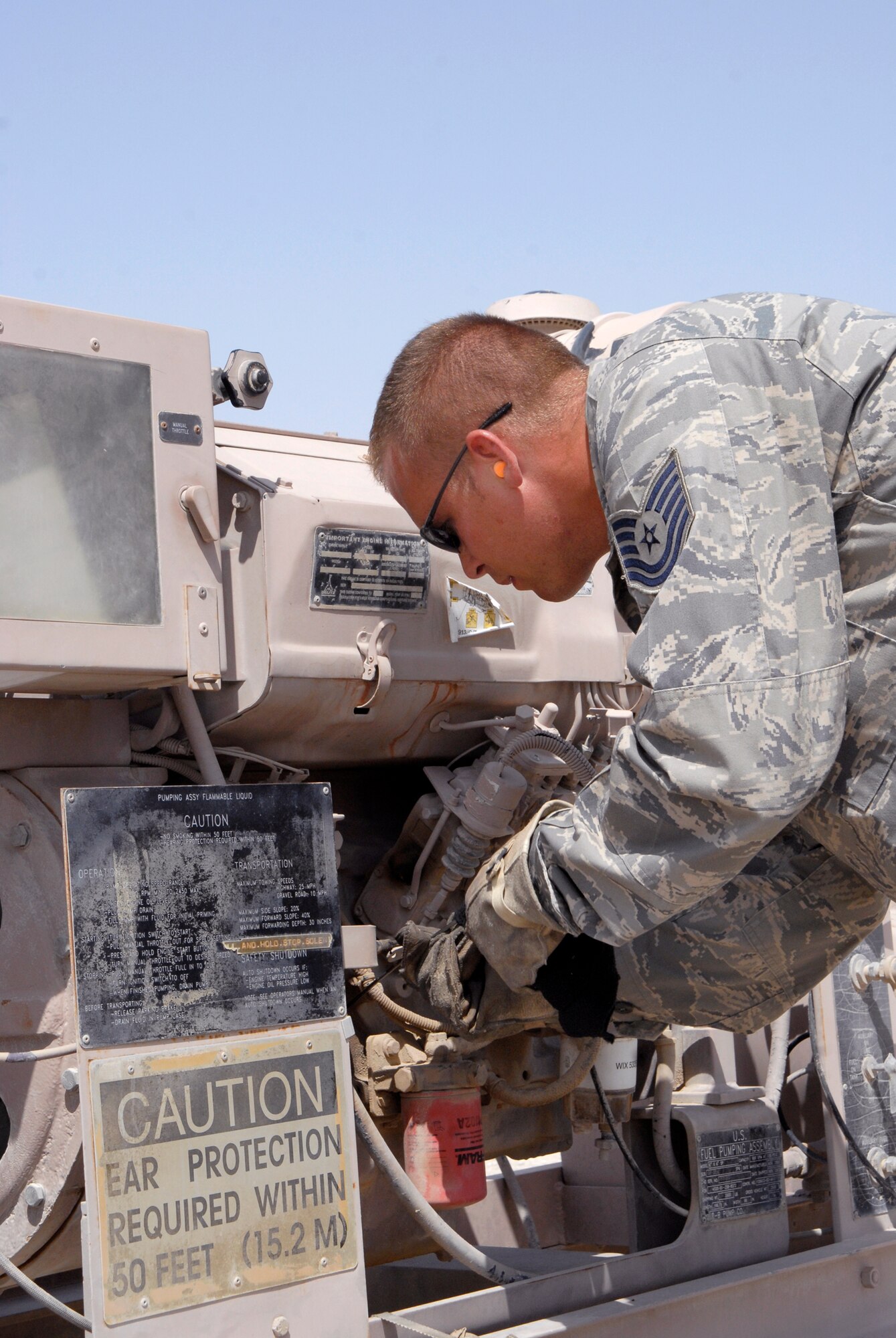 Tech. Sgt. Raymond Carpenter, 379th Expeditionary Logistics Readiness Squadron fuels bulk storage supervisor, performs routine maintenance on an R-22 fuel pump in the bulk expeditionary receiving transportation holding area (BERTHA), Apr. 10, 2009, at an undisclosed location in Southwest Asia.  The fuel held in the BERTHA is distributed to various locations around the base where needed to ensure mission success.  Sergeant Carpenter hails from Princeton, Idaho and is deployed from Ellsworth Air Force Base, S.D. in support of Operations Iraqi and Enduring Freedom and Combined Joint Task Force - Horn of Africa.  (U.S. Air Force photo/Senior Airman Andrew Satran/released)