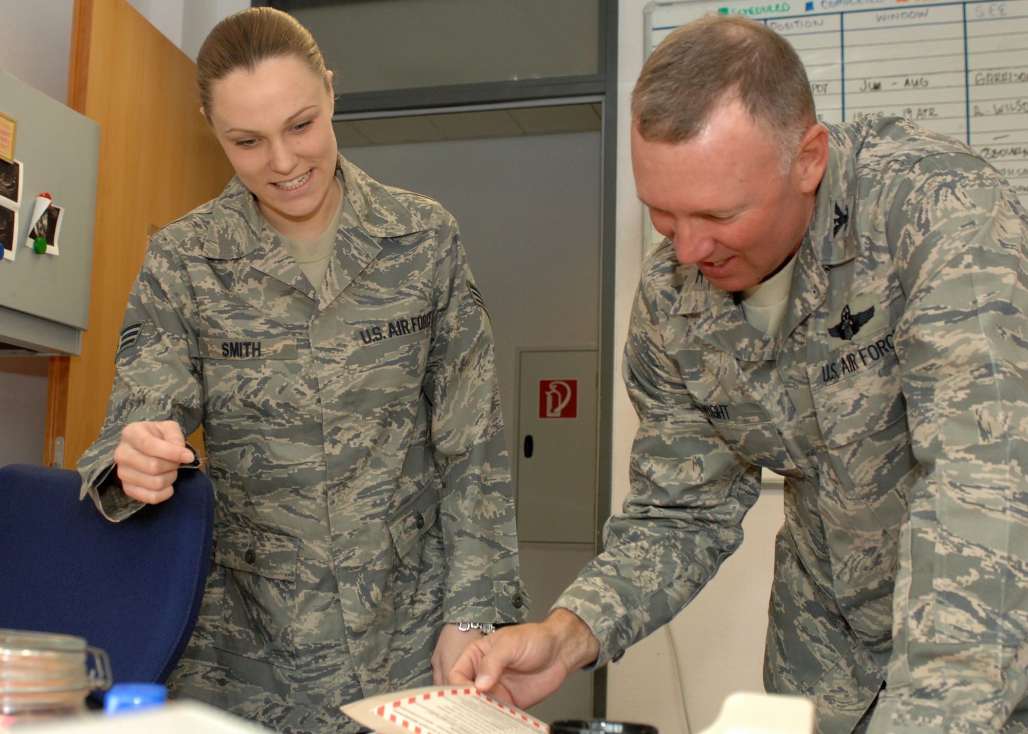 SPANGDAHLEM AIR BASE, Germany -- Senior Airman Mica Smith, 606th Air Control Squadron Surveillance Technician, explains emergency aircraft procedures to Col. Lee T. Wight, 52nd Fighter Wing commander April 7, 2009, as part of the Commander’s Shadow Program. (U.S. Air Force photo by Senior Airman Jenifer H. Calhoun)

