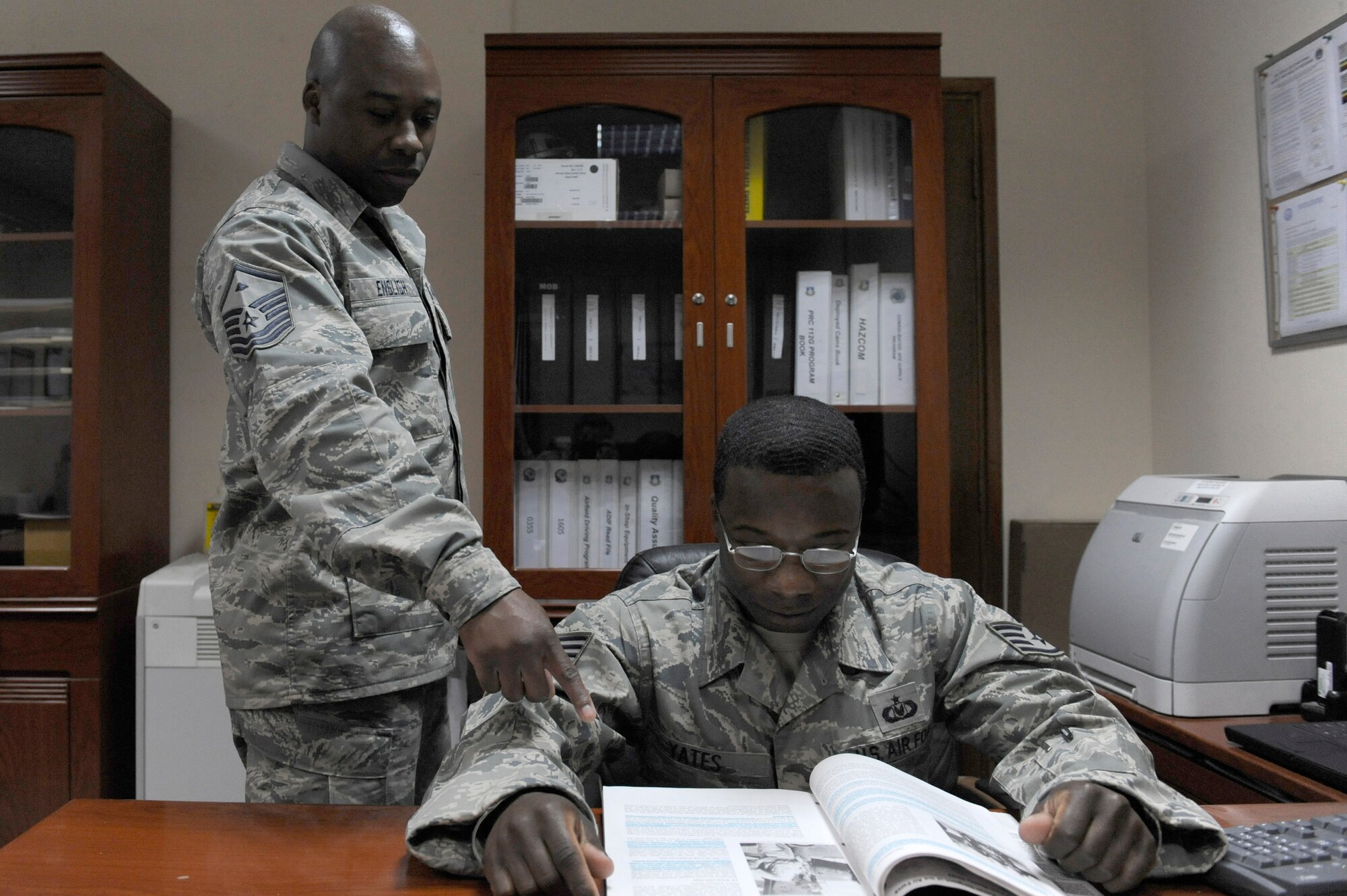 Master Sgt. Brandon English, 380th Operations Group, First Sergeant,
references the professional development guide at an undisclosed location in
Southwest Asia, April 13. Sergeant English is deployed from Peterson AFB,
Colo. and hails from Columbia, S.C. (U.S. Air Force photo by Senior Airman
Brian J. Ellis) (Released)
