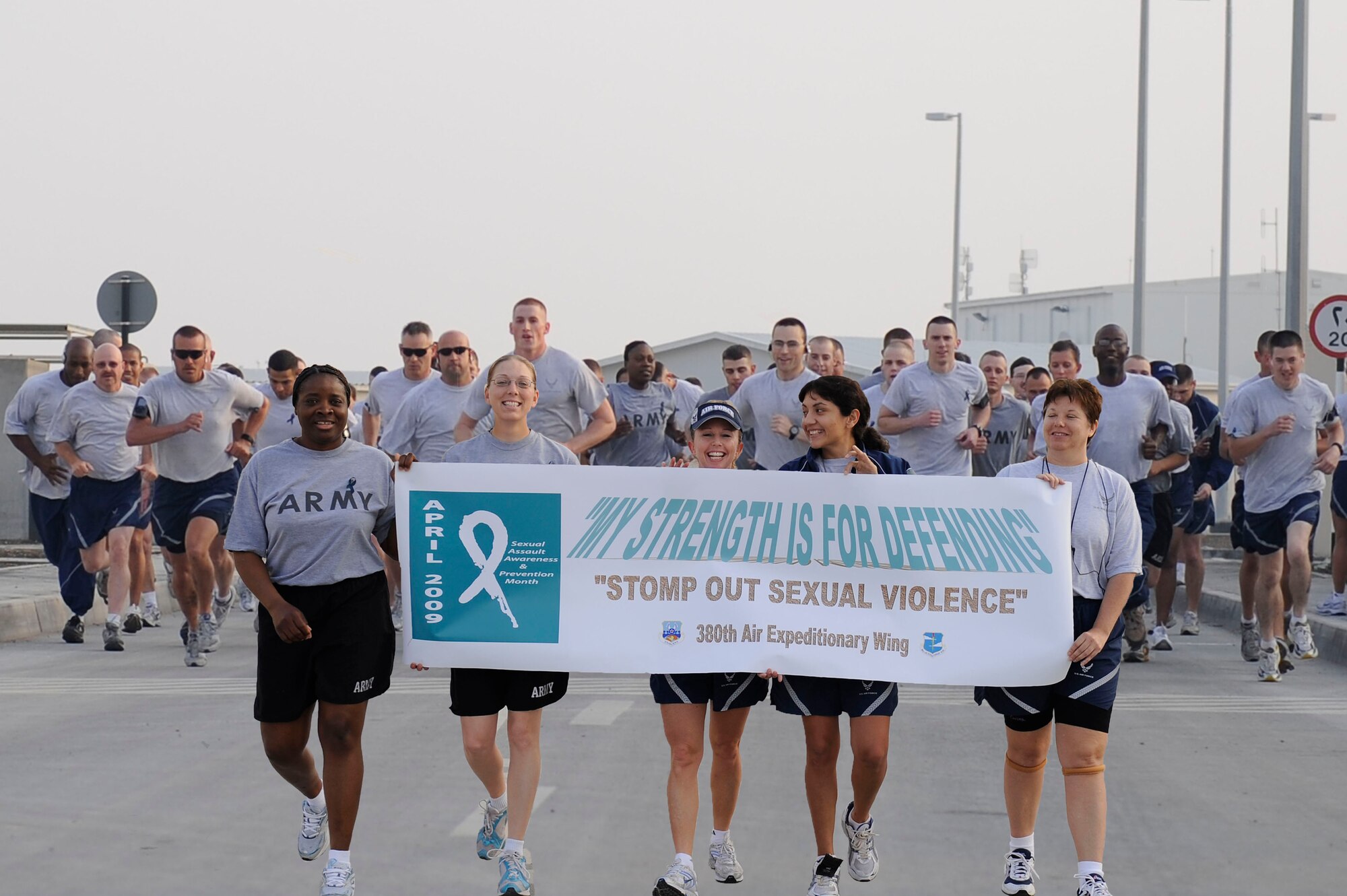 Airmen and Soldiers from the 380th Air Expeditionary Wing participated in a 1 mile walk and 5k/10k run for Sexual Assault Awareness and Prevention Month at an undisclosed location in Southwest Asia, April 8. (Illustration by Senior Airman Brian J. Ellis)