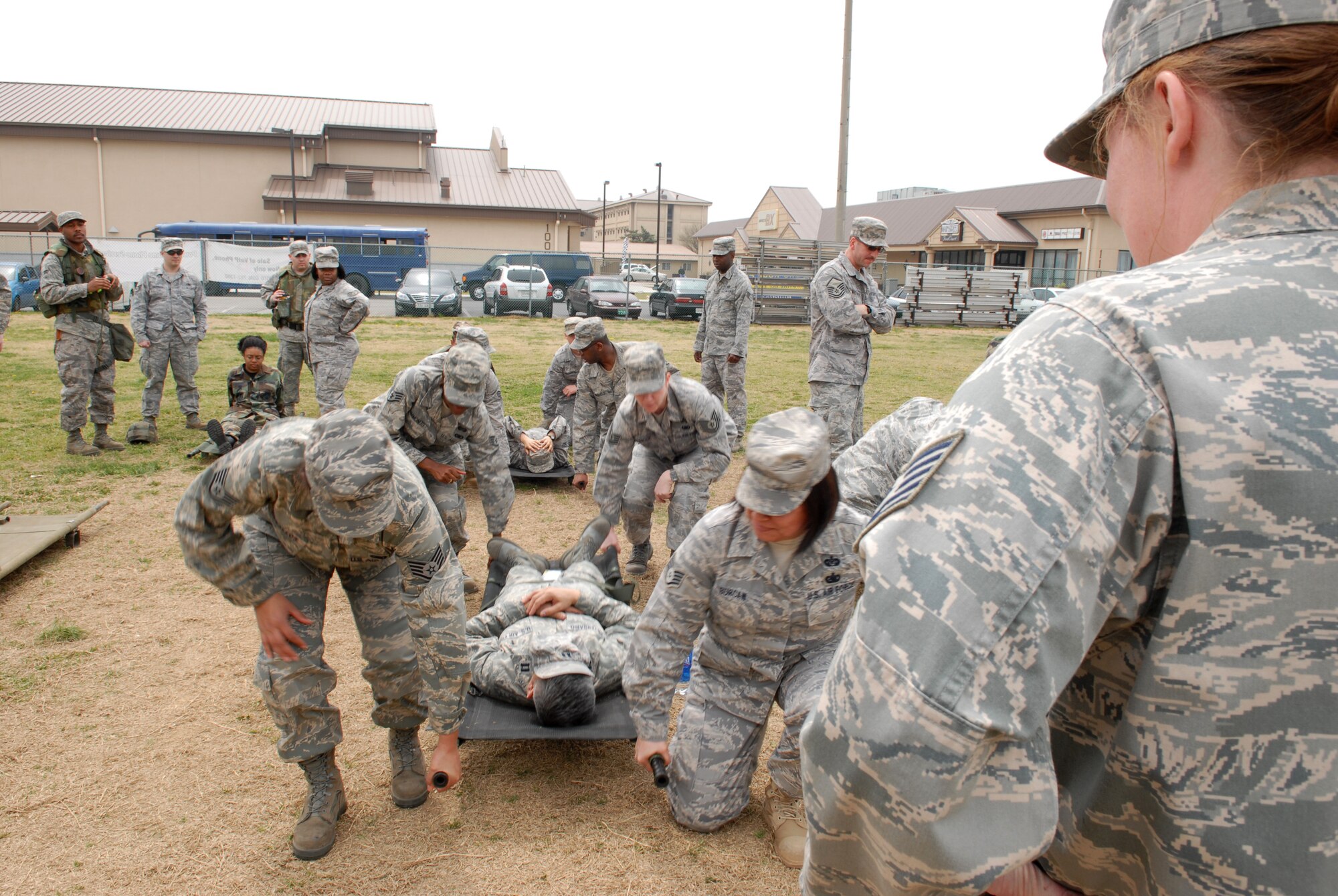 Airmen from the 8th Fighter Wing participate in a litter carry class held by the 8th Medical Group as part of Wolf War Day at Kunsan Air Base, Republic of Korea, April 13, 2009. Wolf War Day was a base-wide refresher for Self Aid and Buddy care, and Ability To Survive and Operate training in preparation for the upcoming Operational Readiness Inspection.  