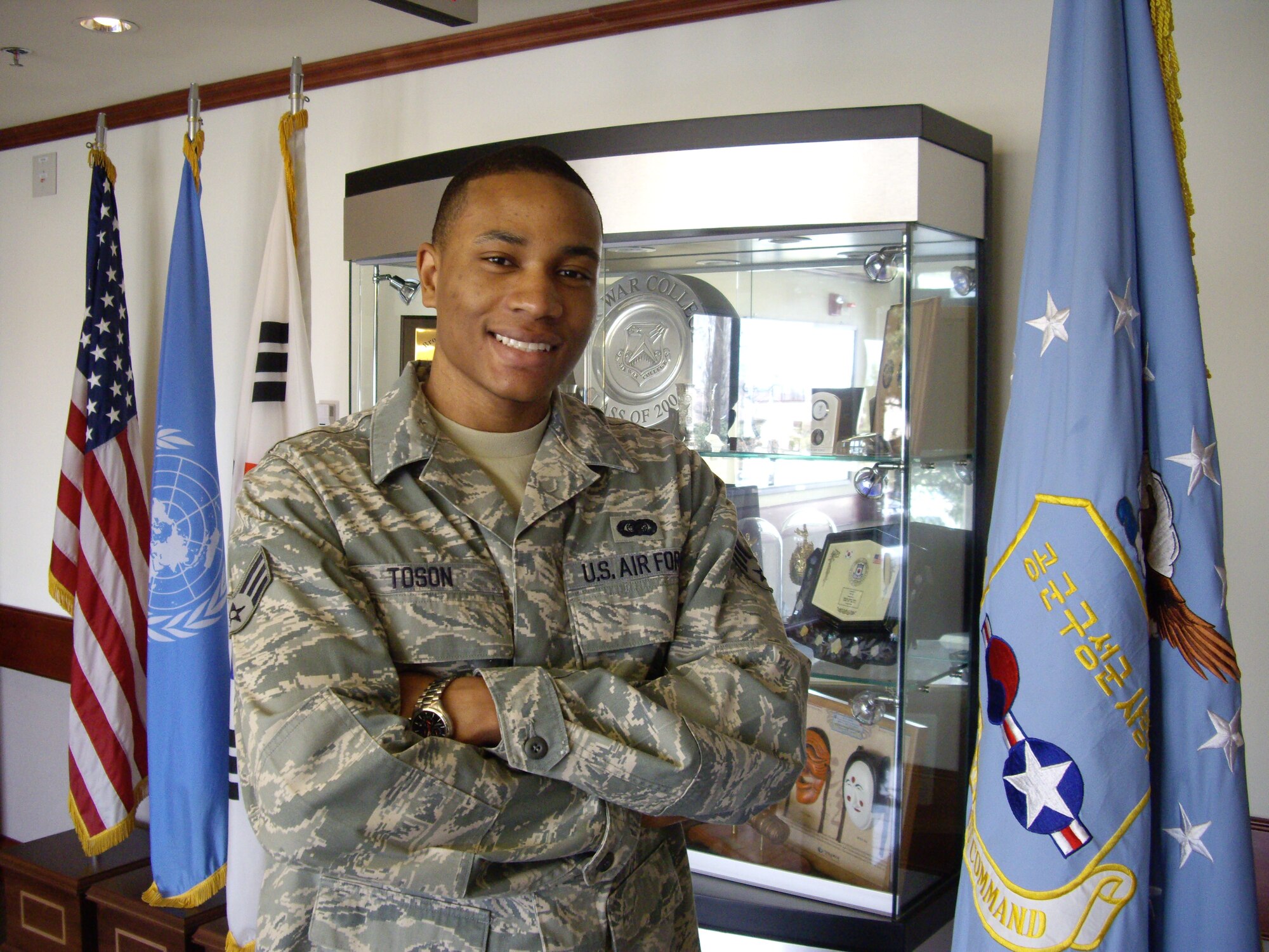 Senior Airman Antwon Toson won "Airman of the Year" for both Pacific Command
and Air Force Element (AFELM). At age 23 and assigned to Headquarters Air
Component Command in Korea, this means he's being recognized as the number
one enlisted airman of all members in the rank of Airman Basic, Airman,
Airman First Class and Senior Airman in the largest theater in the U.S. Air
Force. (Photo by Lt. Col. René White)  
