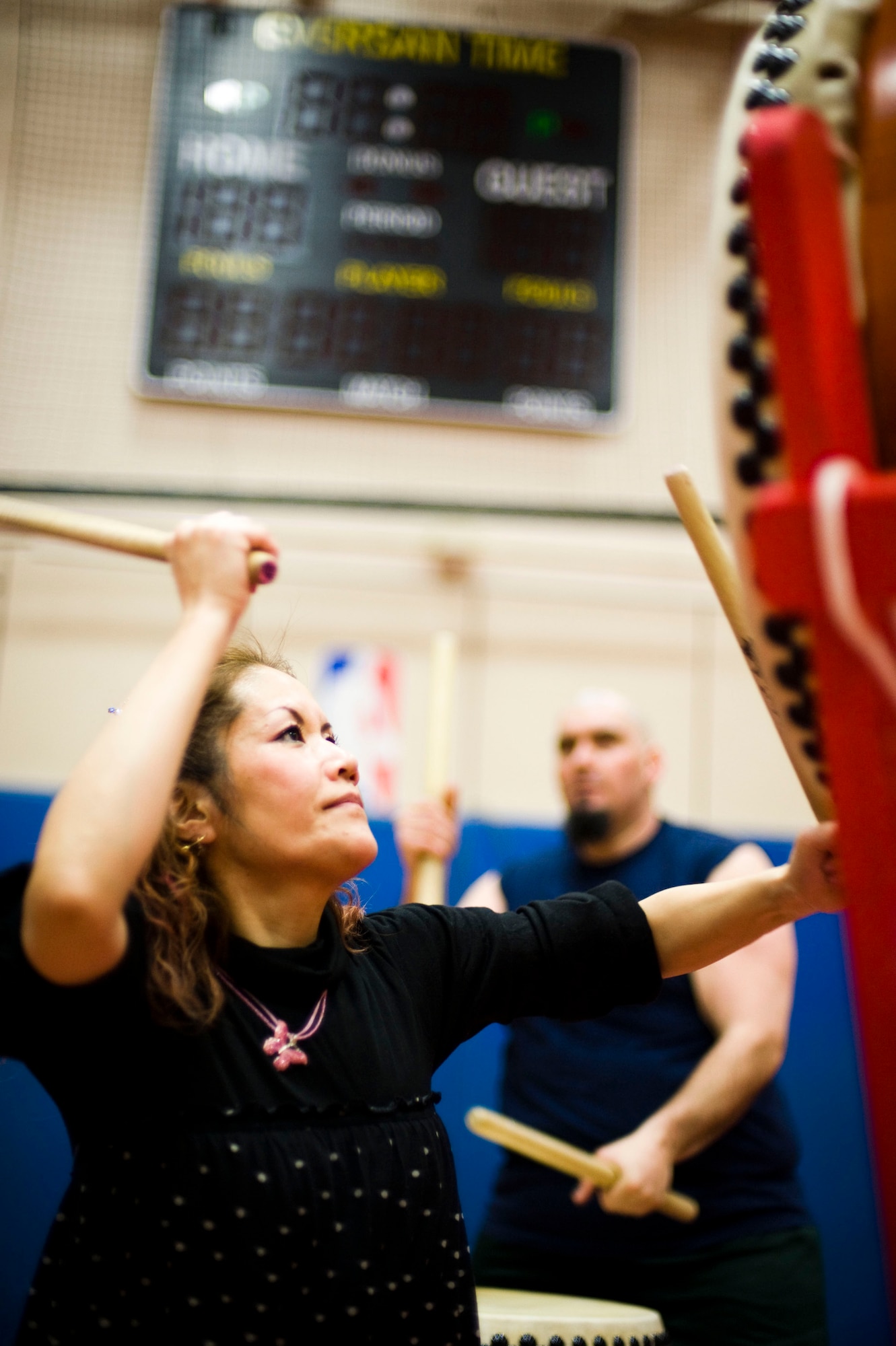 MISAWA AIR BASE, Japan -- Kazuko Igarashi, Dragon-Eagle Taiko team instructor, and David Wray, team captain, practice a taiko song at the Lunney Youth Center Feb. 10, 2009. The team rehearsed at least once a week leading up to the tenth annual performance. (U.S. Air Force photo by Staff Sgt. Samuel Morse)