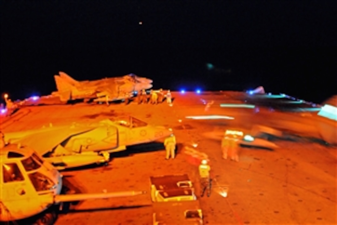 A U.S. Navy AV-8B Harrier aircraft receives fuel during night operations aboard the amphibious assault ship USS Essex to prepare for the Balikatan exercise in the South China Sea, April 11, 2009. The Republic of the Philippines has invited Essex to participate in the exercise, an annual event that involves U.S. military and Armed Forces of the Philippines.