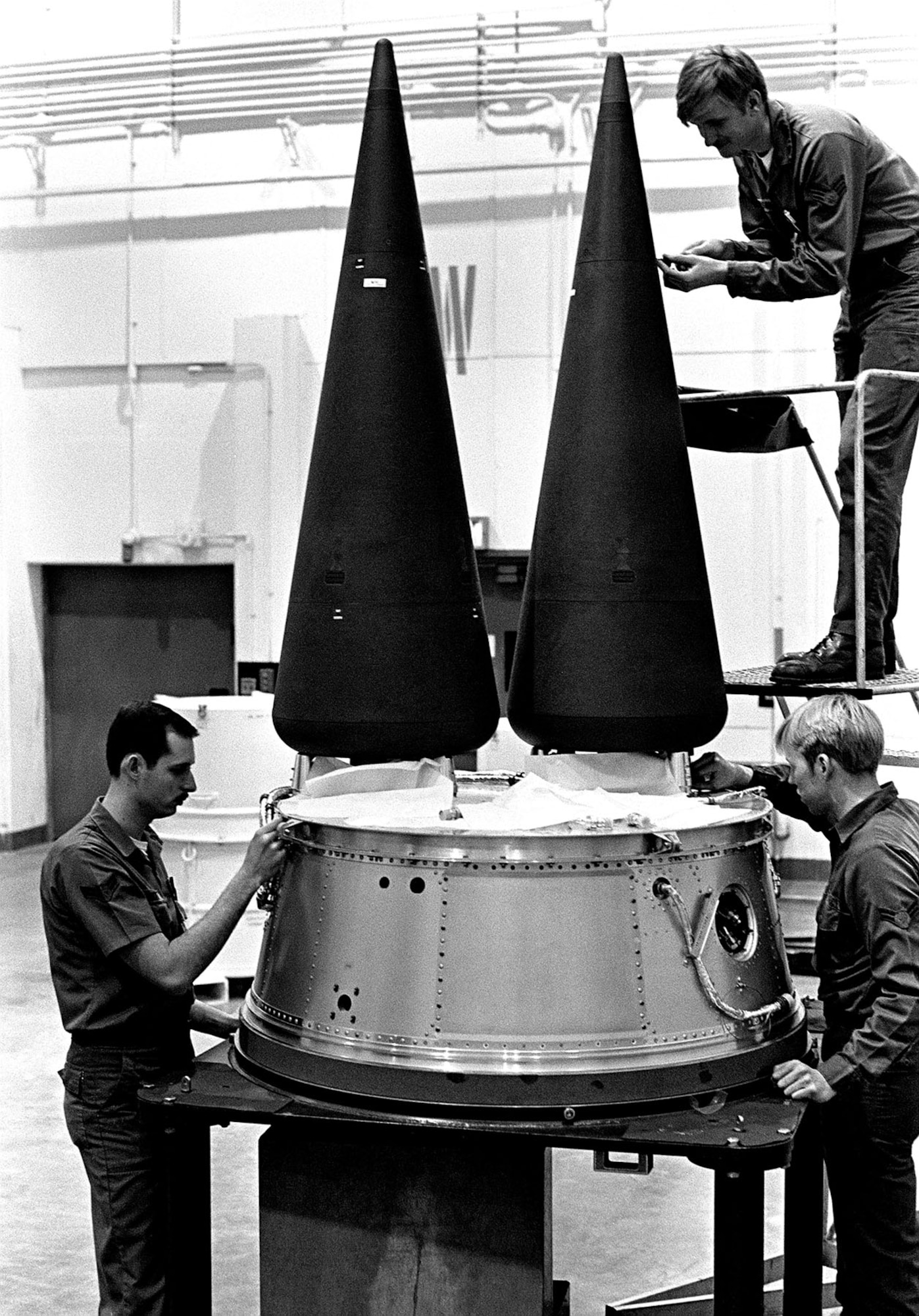 Airmen work on a Minuteman III’s Multiple Independently-targetable Re-entry Vehicle (MIRV) system. Current missiles carry a single warhead. (U.S. Air Force photo)
