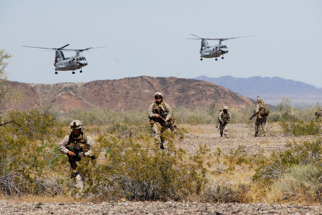 Marines with the 3rd Battalion, 9th Marine Regiment, set up a perimeter around a landing zone on an Army Yuma Proving Ground range in Yuma, Ariz., during an air assault exercise April 13, 2009. The battalion is training for its deployment in August 2009. The Camp Lejeune, N.C., battalion is scheduled to conclude their training in Yuma with a battalion-sized helicopter-borne assault exercise in late April, the largest exercise of its type conducted in approximately 10 years.