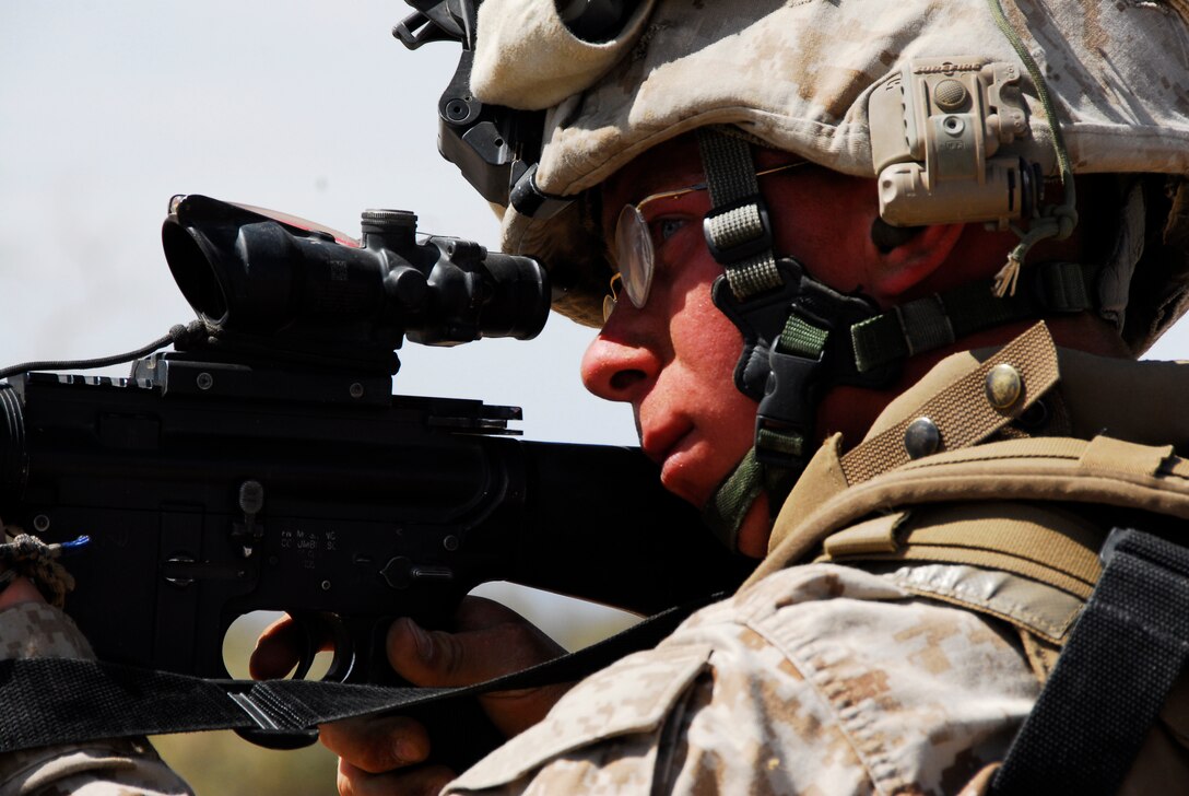 A Marine with the 3rd Battalion, 9th Marine Regiment, aims in on a target at a landing zone on an Army Yuma Proving Ground range in Yuma, Ariz., during an air assault exercise April 13, 2009. The Camp Lejeune, N.C., battalion is scheduled to conclude their training in Yuma with a battalion-sized helicopter-borne assault exercise in late April, the largest exercise of its type conducted in approximately 10 years.