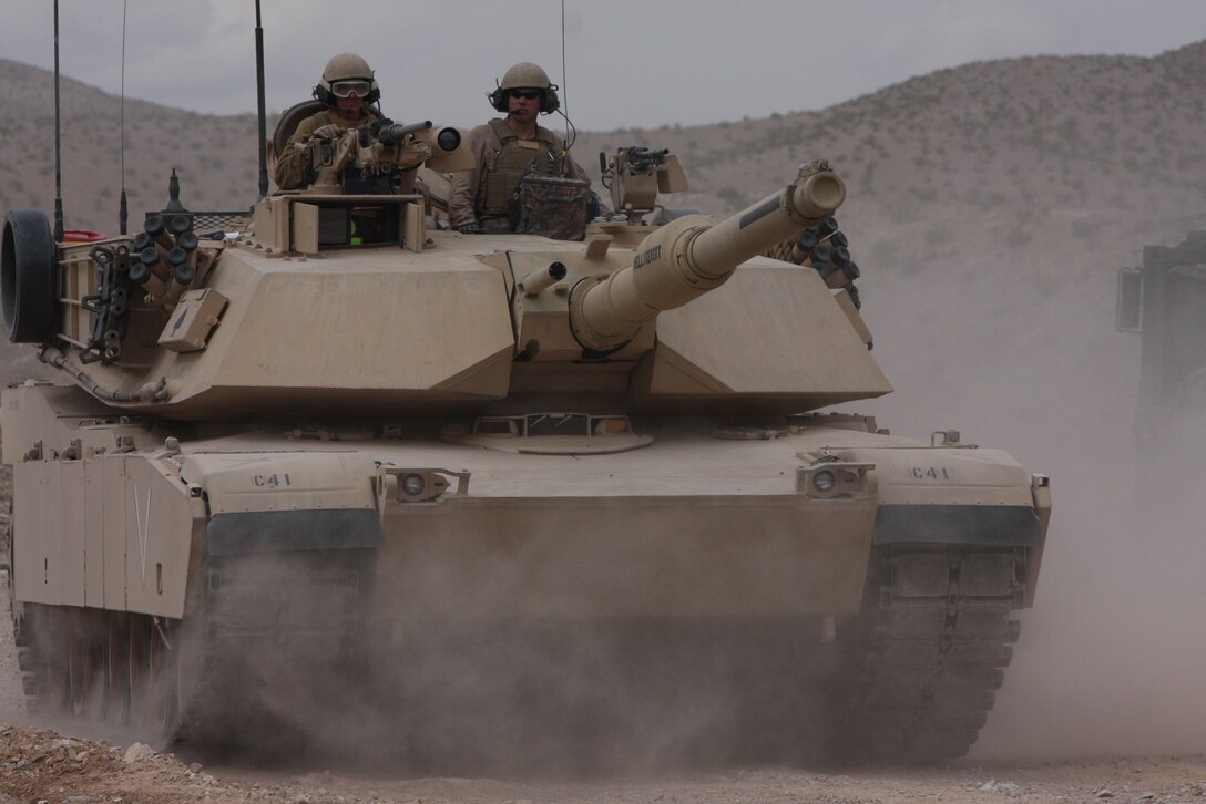 Marines of 1st platoon, Company C, 1st Tank Battalion, return to their command post to refuel their tanks during a five-day, live-fire annual training exercise at Noble Pass April 14.