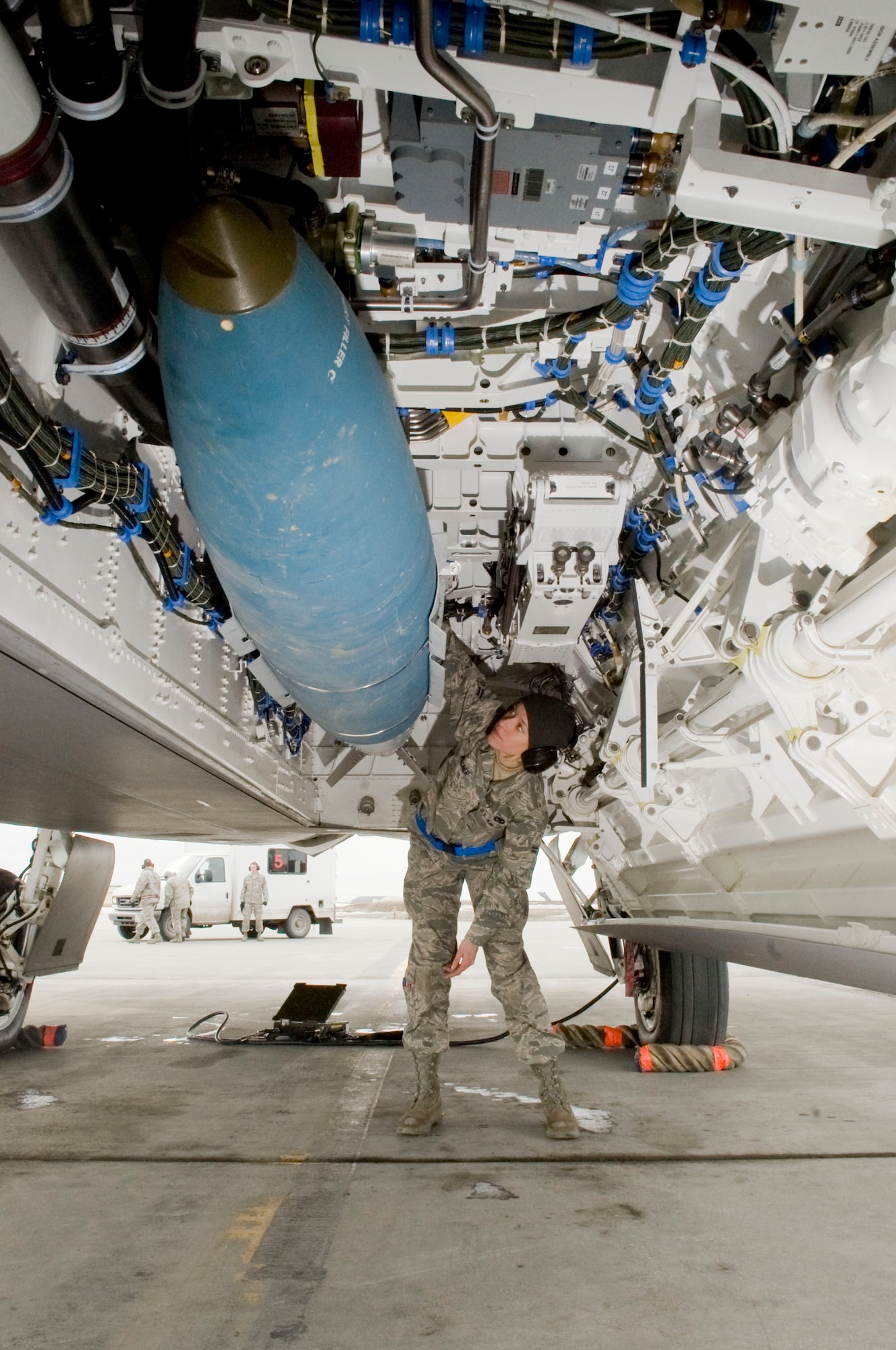 ELMENDORF AIR FORCE BASE, Alaska--Airman 1st Class Amber Wagner inspects Joint Direct Attack Munitions (JDAM) after being loaded onto an F-22 Raptor April 14, 2009. Airman Wagner from the 525th Aircraft Maintenance Unit ensures that the first JDAM dropped by 525th Fighter Squadron is successful. (U.S. Air Force photo by Senior Airman Jonathan Steffen)