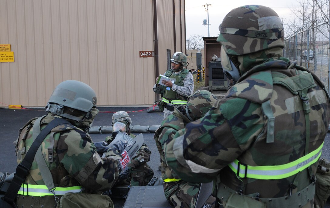 DAEGU AIR BASE, Republic of Korea -- Tech. Sgt. Frank Starks, an exercise evaluator from the 320th Special Tactics Squadron, takes notes during a building evacuation in a simulated chemical environment here March 24. More than 350 members and several aircraft assigned to the 353rd Special Operations Group spent nearly a month at Daegu Air Base, Republic of Korea, testing and assessing their wartime skills necessary to survive and operate in any environment. (U.S. Air Force photo by Tech. Sgt. Aaron Cram)