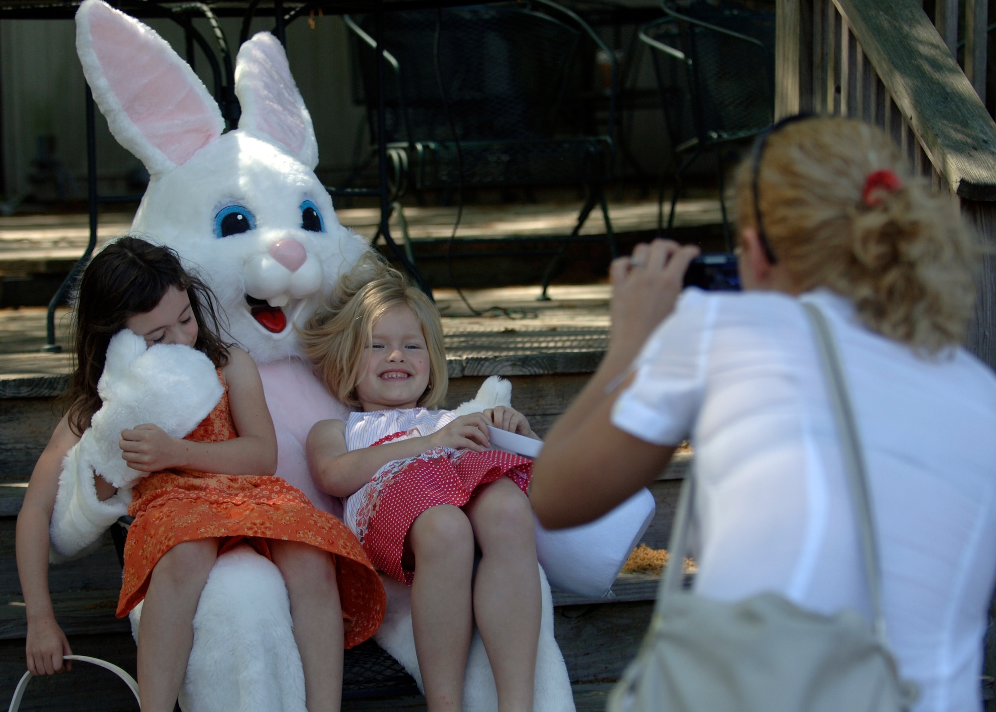 Sarah King (left) and Vika Bach (right) get their photo taken with the Easter bunny during the Easter egg hunt April 11. Sarah is the 6-year-old daughter of Tech. Sgt. Steven King and Vika is the 7-year-old daughter of Staff Sgt. Dan Davis. Sergeant King is the NCO in charge of combat arms for the 437th Security Forces Squadron and Sergeant Davis is a loadmaster with the 17th Airlift Squadron. (U.S. Air Force photo/Senior Airman Timothy Taylor)