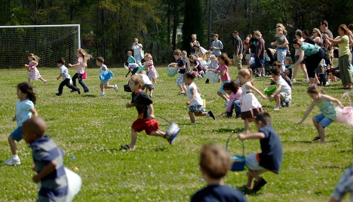 Children from the 3 to 4 age group sprint onto the soccer field at Youth Programs to hunt for Easter eggs April 11. More than 100 man-hours were put into filling approximately 2,000 empty eggs by the youth center workers and volunteers. (U.S. Air Force photo/Senior Airman Timothy Taylor)