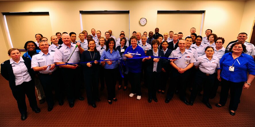 DYESS AIR FORCE BASE, Texas - In keeping in line with Texas "Go Blue Day" the 7th Medical Group at Dyess Air Force Base puts on their blues and cuts through child abuse. Both active duty and civilian members of the 7th Medical Group wore blue to symbolize their commitment to stop child abuse on the base and in the community. The Medical Group offers various educational programs to help parents with the issues which could lead to abuse and/or neglect of a child. These programs include: parenting classes, dad programs, stress management, anger management, drug and alcohol education and counseling (both individual and marriage). (U.S. Air Force photo by Airman 1st Class Stephen Reyes) 
