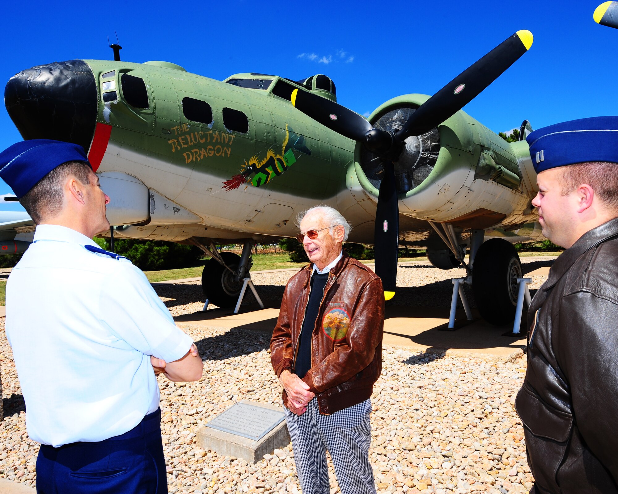 DYESS AIR FORCE BASE, Texas - From left to right Col. Gavin Ketchen, Paul Rehm, and Capt. Jeffrey Clesse share flying stories in front of the B-17 Flying Fortress in the Air Park here Monday, April 13.  Mr. Rehm was a B-17 navigator during World War II. He was a member of the first daylight bombing raid onto Germany.  (U.S. Air Force phot by SSgt Alan Garrison)