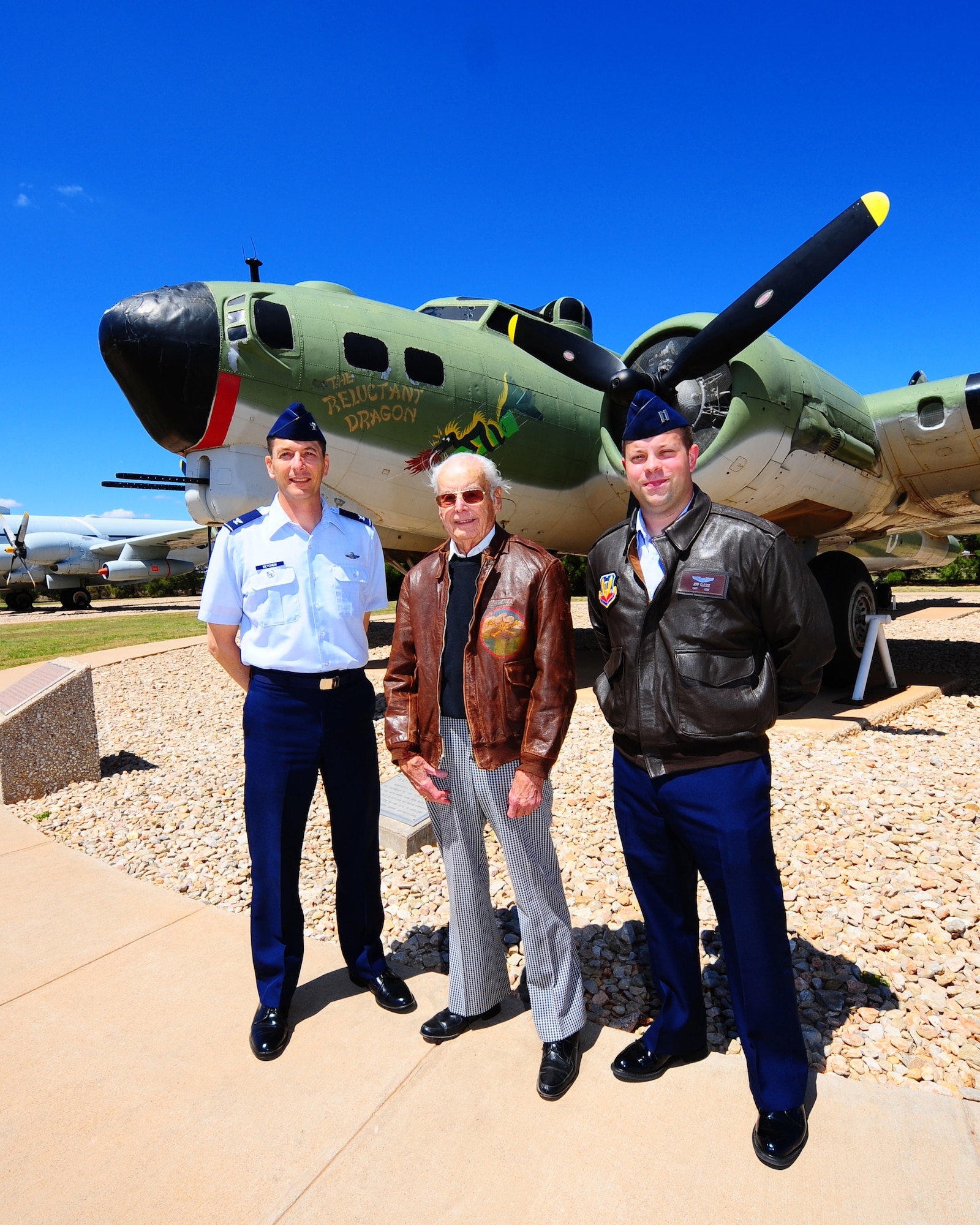 DYESS AIR FORCE BASE, Texas - From left to right Col. Gavin Ketchen, Paul Rehm, and Capt. Jeffrey Clesse share flying stories in front of the B-17 Flying Fortress in the Air Park here Monday, April 13.  Mr. Rehm was a B-17 navigator during World War II. He was a member of the first daylight bombing raid onto Germany.  (U.S. Air Force phot by SSgt Alan Garrison)