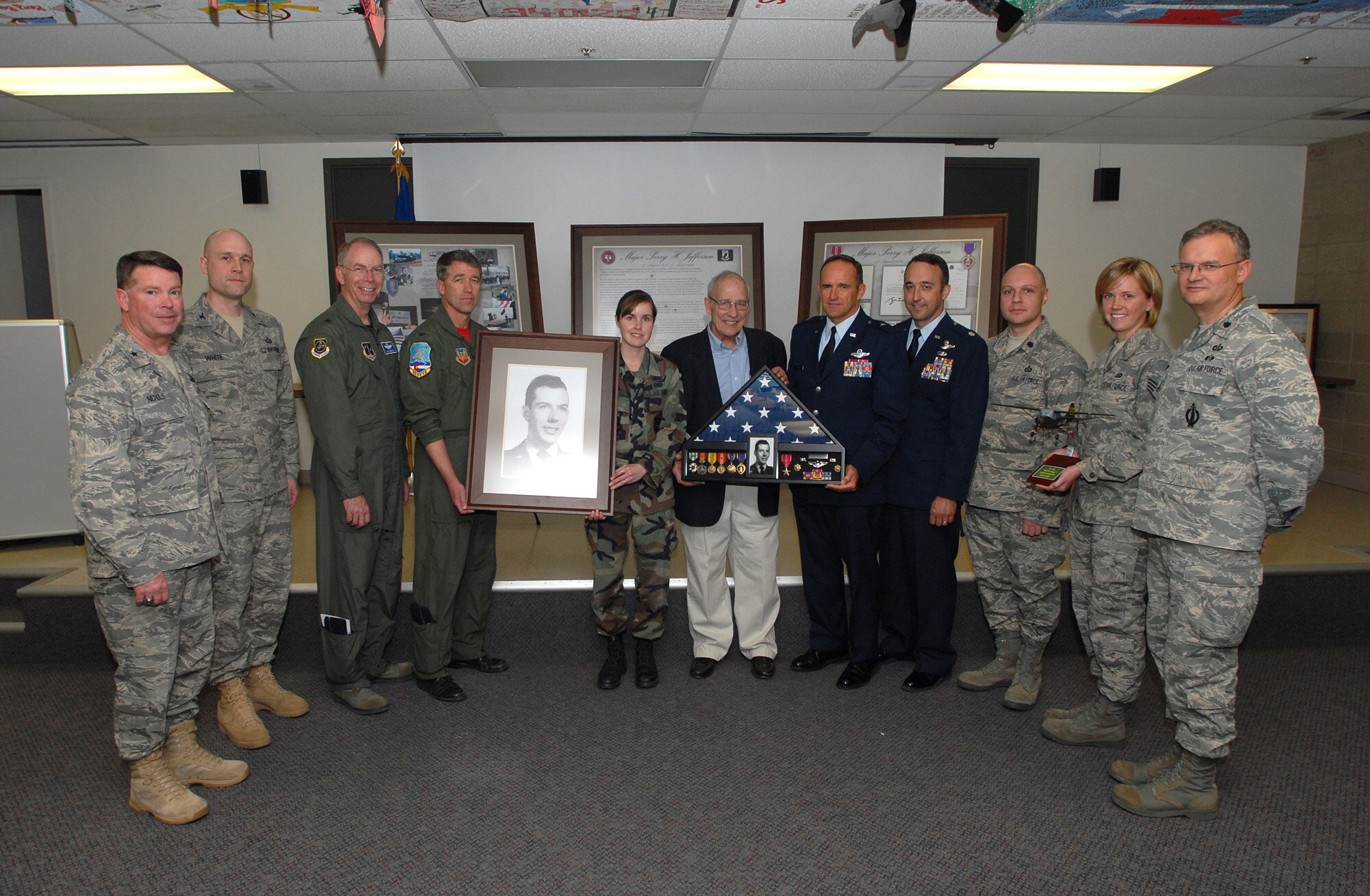 The gropu of people representing Colorado members, as well as National Guard Members of the Intelligence community honoring Major Perry Jefferson during the auditorium dedication ceremony.