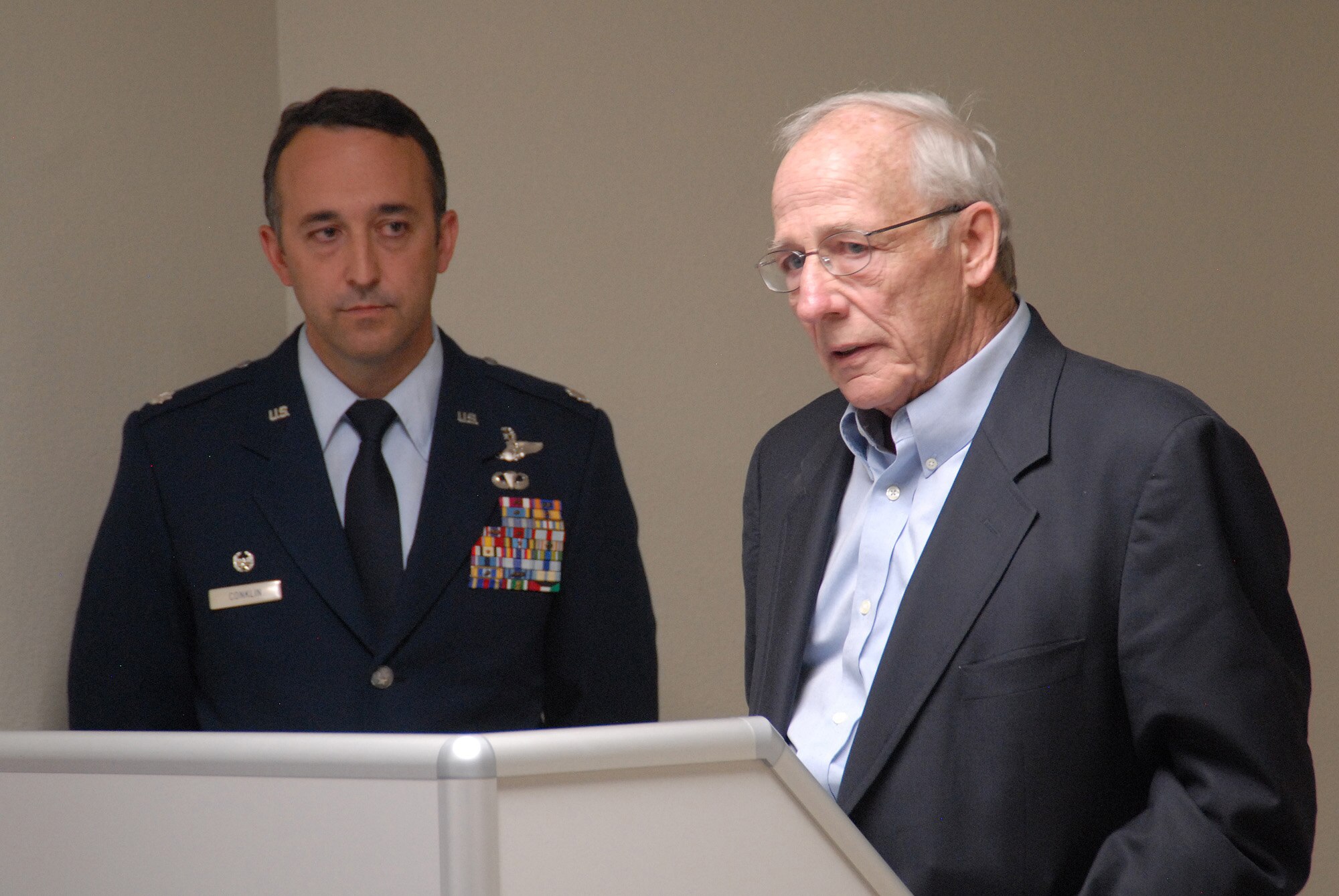 Mr. Mike Jefferson speaks during a dedication ceremony for his brother, Major Perry Jefferson as LtCol Timothy Conklin looks on.