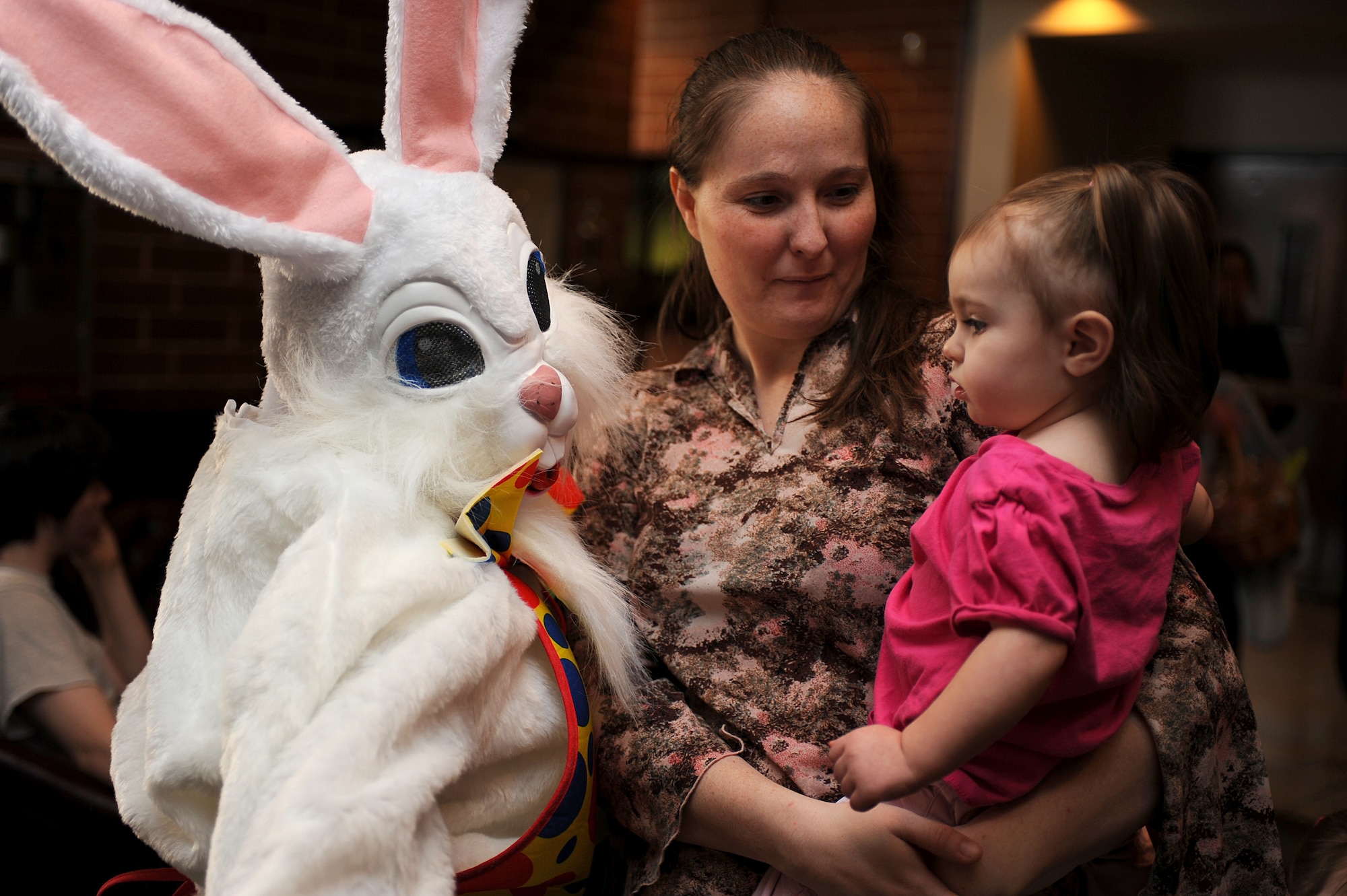 Jennifer Bevier introduces her 15 month old daughter, Adrianne Bevier, to the Easter bunny during a Easter party at the Expeditionary Center on Fort Dix, N.J., April 4, 2009.  The Easter party consisted of arts and crafts, a photo session with the Easter bunny and an Easter egg hunt.   (U.S. Air Force Photo/Staff Sgt. Nathan G. Bevier) 