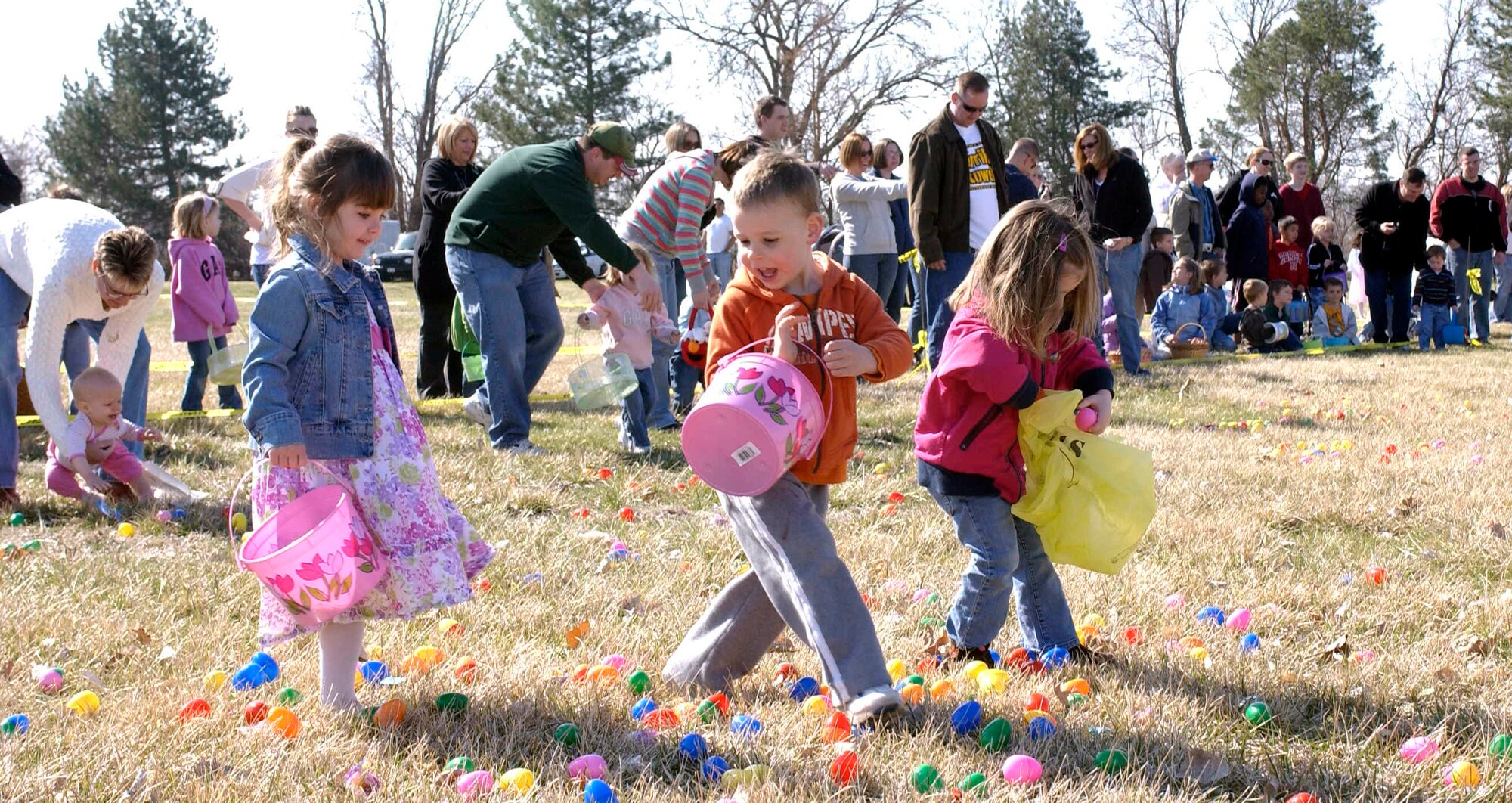 OFFUTT AIR FORCE BASE, Neb. -- A group of children in the 4-6 year old group move through a field of eggs during Offutt's annual Easter egg scramble at the base lake April 11. The scramble allowed children and parents to get their fill of toy eggs and candy.  U.S. Air Force Photo By: Staff Sgt. Richard Williams