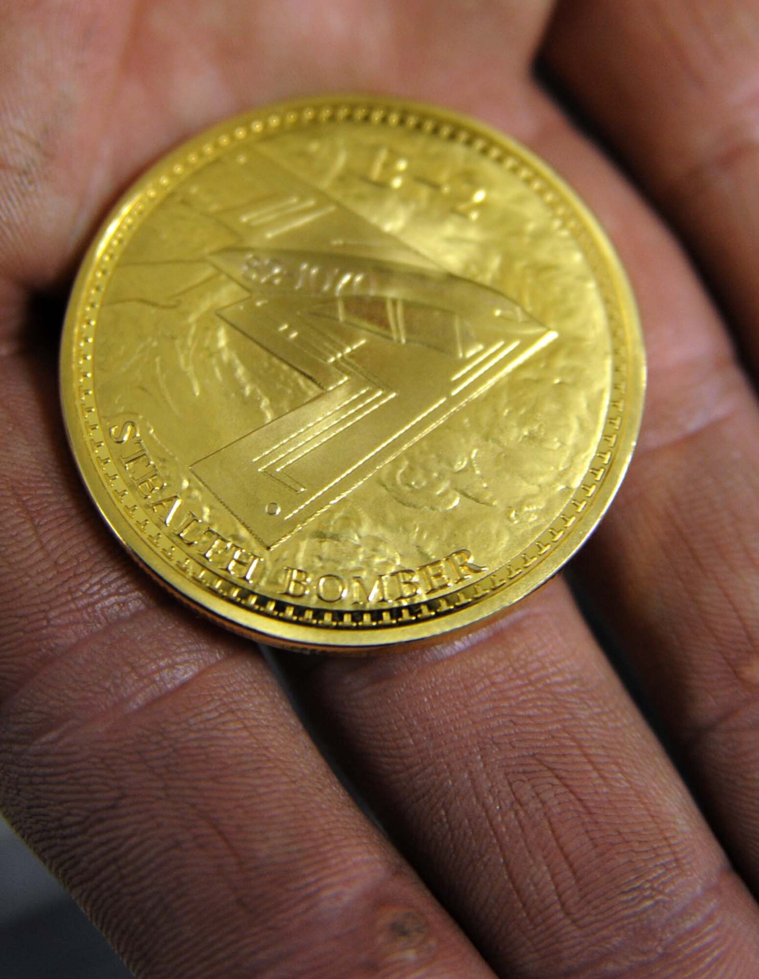 WHITEMAN AIR FORCE BASE, Mo. - Staff Sgt. David Shockley 509th Aircraft Maintenance Squadron crew chief, displays the Dedicated Crew Chief coin he received during a ceremony April 10. Sergeant Shockley is the DCC for the B-2 "Spirit of Ohio." (U.S. Air Force photo/Senior Airman Jason Huddleston)